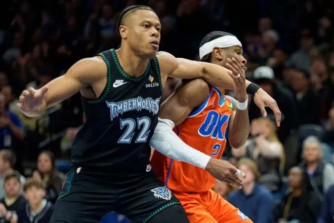 Jan 29, 2026; Minneapolis, Minnesota, USA; Minnesota Timberwolves guard Jaylen Clark (22) fouls Oklahoma City Thunder guard Shai Gilgeous-Alexander (2) in the second quarter at Target Center. Mandatory Credit: Matt Blewett-Imagn Images