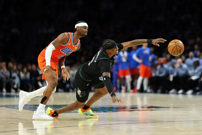 MINNEAPOLIS, MINNESOTA - JANUARY 29: Shai Gilgeous-Alexander #2 of the Oklahoma City Thunder fouls Jaden McDaniels #3 of the Minnesota Timberwolves in the third quarter at Target Center on January 29, 2026 in Minneapolis, Minnesota. The Timberwolves defeated the Thunder 123-111. NOTE TO USER: User expressly acknowledges and agrees that, by downloading and or using this photograph, User is consenting to the terms and conditions of the Getty Images License Agreement. (Photo by David Berding/Getty Images)