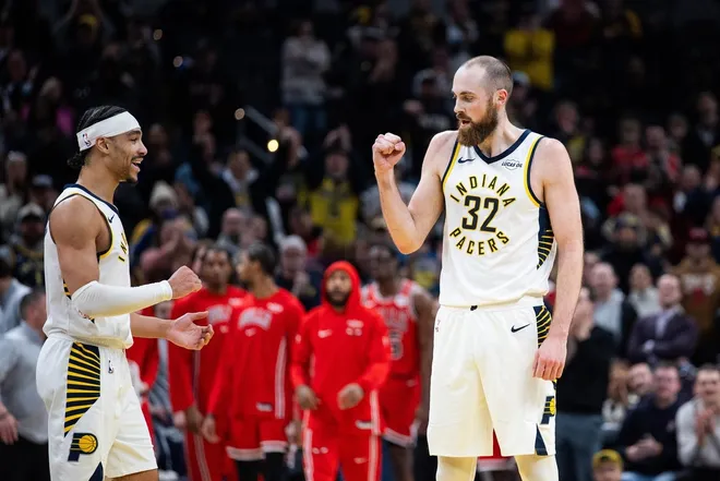 Jan 28, 2026; Indianapolis, Indiana, USA; Indiana Pacers center Jay Huff (32) celebrates the win with guard/forward Andrew Nembhard (2) after the game against the Chicago Bulls at Gainbridge Fieldhouse.