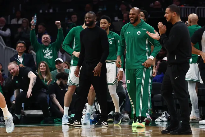 Jan 30, 2026; Boston, Massachusetts, USA; Boston Celtics guard Jaylen Brown (7) (in street clothes) smiles after a Celtic basket during the second quarter against the Sacramento Kings at TD Garden. Mandatory Credit: Winslow Townson-Imagn Images