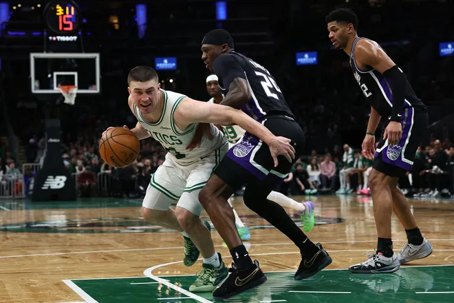 Jan 30, 2026; Boston, Massachusetts, USA; Boston Celtics guard Payton Pritchard (11) looks for a way around Sacramento Kings guard Daeqwon Plowden (29) during the second half at TD Garden. Mandatory Credit: Winslow Townson-Imagn Images
