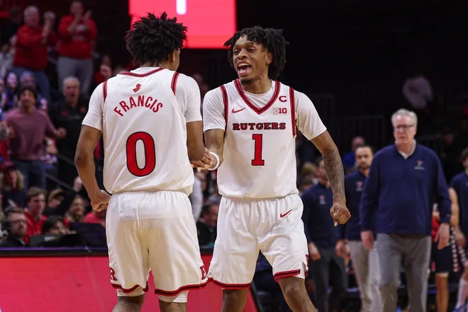 Dec 20, 2025; Piscataway, New Jersey, USA; Rutgers Scarlet Knights guard Tariq Francis (0) and guard Jamichael Davis (1) celebrates after a basket against the Penn Quakers during the second half at Jersey Mike's Arena.