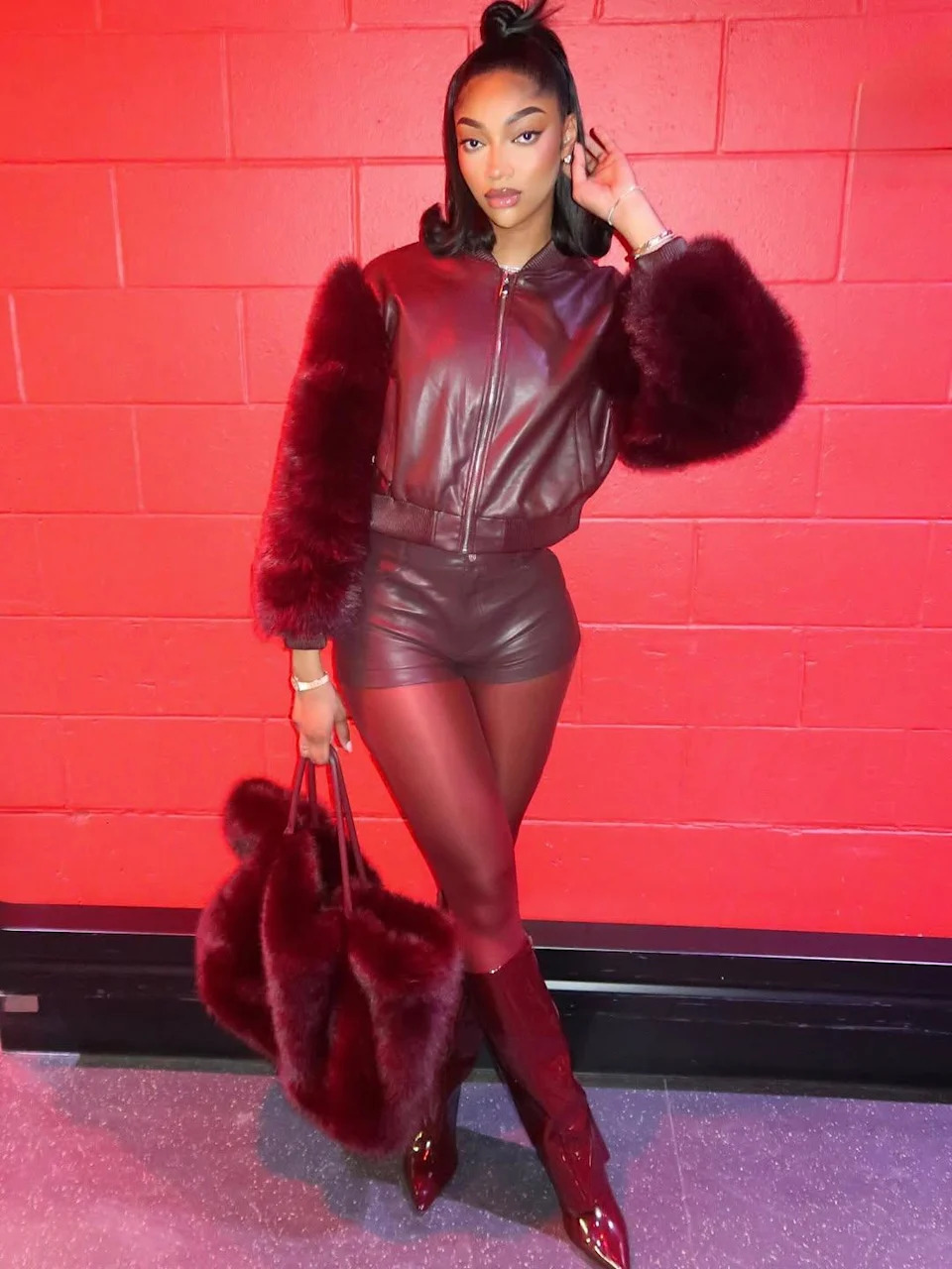 Angel Reese posing for a picture. 