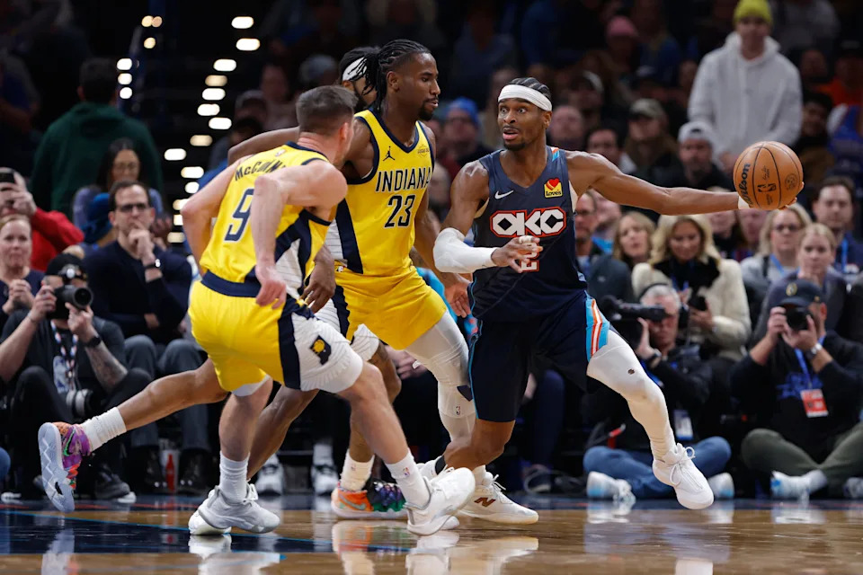 Jan 23, 2026; Oklahoma City, Oklahoma, USA; Oklahoma City Thunder guard Shai Gilgeous-Alexander (2) moves the ball around Indiana Pacers guard/forward Aaron Nesmith (23) during the second half at Paycom Center. Mandatory Credit: Alonzo Adams-Imagn Images