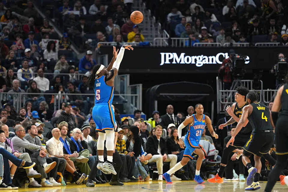 Jan 2, 2026; San Francisco, California, USA; Oklahoma City Thunder guard Luguentz Dort (5) shoots a three point basket against the Golden State Warriors during the second quarter at Chase Center. Mandatory Credit: Darren Yamashita-Imagn Images