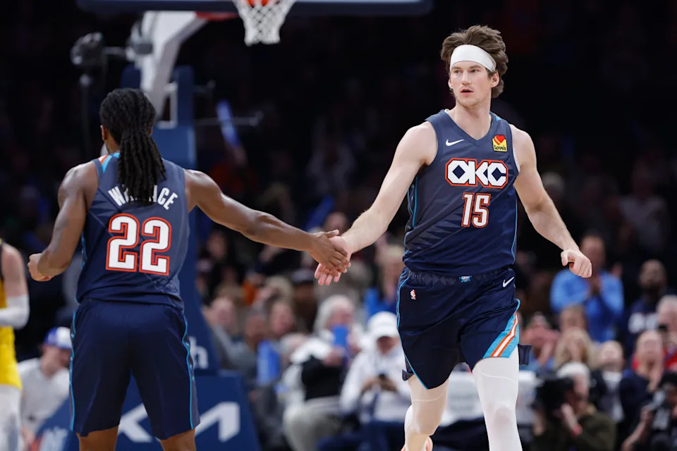 Jan 23, 2026; Oklahoma City, Oklahoma, USA; Oklahoma City Thunder center Branden Carlson (15) and guard Cason Wallace (22) celebrate after a play against the Indiana Pacers during the second half at Paycom Center. Mandatory Credit: Alonzo Adams-Imagn Images