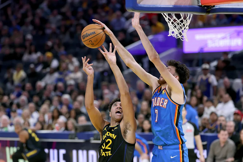 SAN FRANCISCO, CALIFORNIA - JANUARY 02: Chet Holmgren #7 of the Oklahoma City Thunder blocks a shot by Trayce Jackson-Davis #32 of the Golden State Warriors during the first half at Chase Center on January 02, 2026 in San Francisco, California. NOTE TO USER: User expressly acknowledges and agrees that, by downloading and/or using this photograph, user is consenting to the terms and conditions of the Getty Images License Agreement. (Photo by Ezra Shaw/Getty Images)