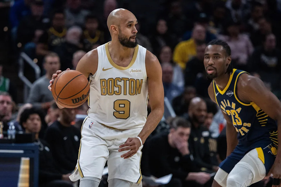 Jan 12, 2026; Indianapolis, Indiana, USA; Boston Celtics guard Derrick White (9) dribbles the ball while Indiana Pacers guard/forward Aaron Nesmith (23) defends in the first half at Gainbridge Fieldhouse. Mandatory Credit: Trevor Ruszkowski-Imagn Images