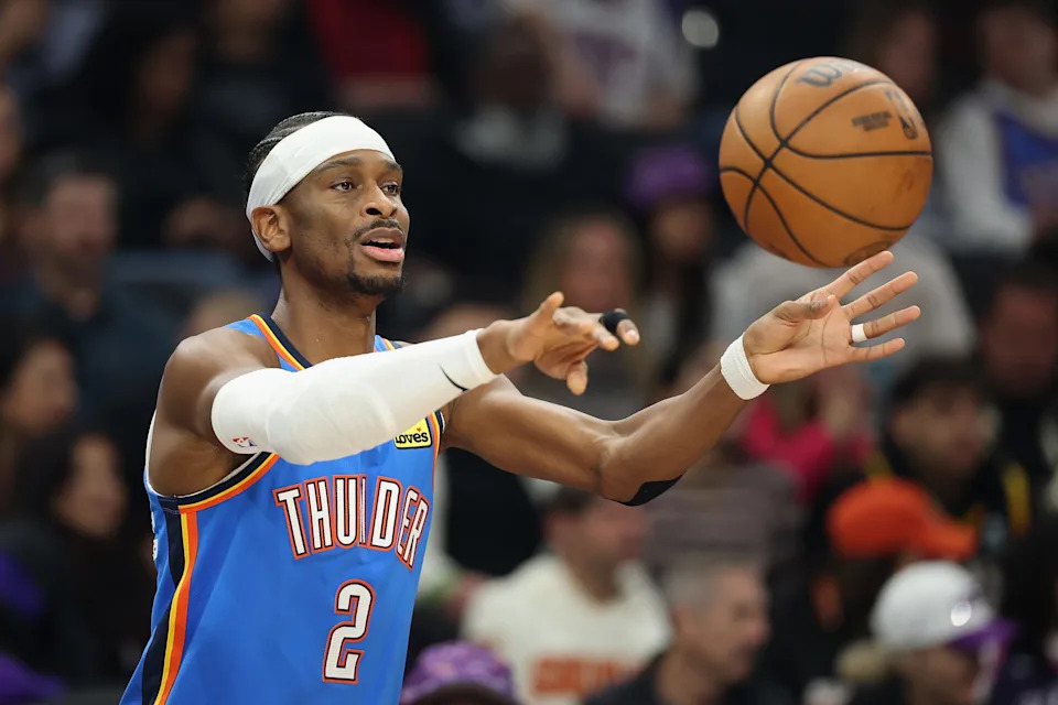 PHOENIX, ARIZONA - JANUARY 04: Shai Gilgeous-Alexander #2 of the Oklahoma City Thunder passes the ball during the first half of the NBA game against the Phoenix Suns at Mortgage Matchup Center on January 04, 2026 in Phoenix, Arizona. The Suns defeated the Thunder 108-105. NOTE TO USER: User expressly acknowledges and agrees that, by downloading and or using this photograph, user is consenting to the terms and conditions of the Getty Images License Agreement. (Photo by Christian Petersen/Getty Images)