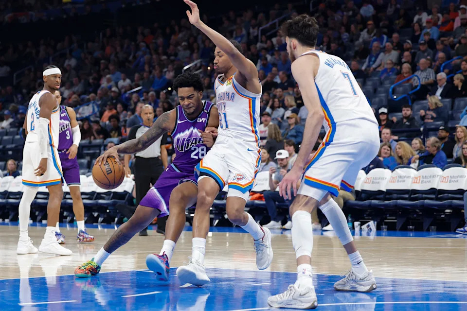 Jan 7, 2026; Oklahoma City, Oklahoma, USA; Utah Jazz forward Brice Sensabaugh (28) drives against Oklahoma City Thunder guard Aaron Wiggins (21) during the second half at Paycom Center. Mandatory Credit: Alonzo Adams-Imagn Images
