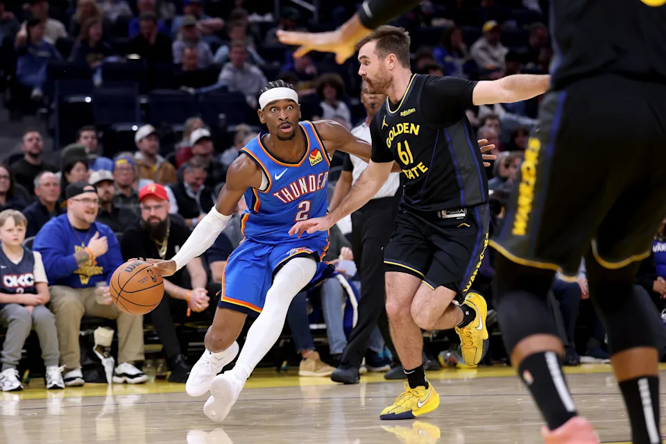SAN FRANCISCO, CALIFORNIA - JANUARY 02: Shai Gilgeous-Alexander #2 of the Oklahoma City Thunder is guarded by Pat Spencer #61 of the Golden State Warriors during the second half at Chase Center on January 02, 2026 in San Francisco, California. NOTE TO USER: User expressly acknowledges and agrees that, by downloading and/or using this photograph, user is consenting to the terms and conditions of the Getty Images License Agreement. (Photo by Ezra Shaw/Getty Images)
