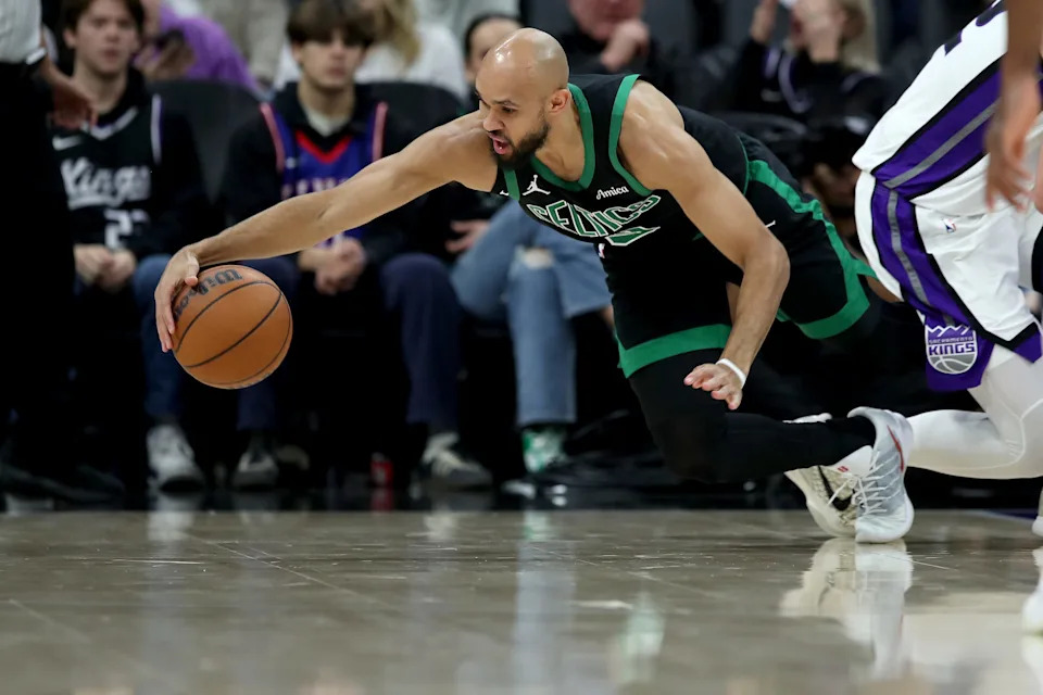 Jan 1, 2026; Sacramento, California, USA; Boston Celtics guard Derrick White (9) dives for a loose ball against the Sacramento Kings during the second quarter at Golden 1 Center. Mandatory Credit: Dennis Lee-Imagn Images