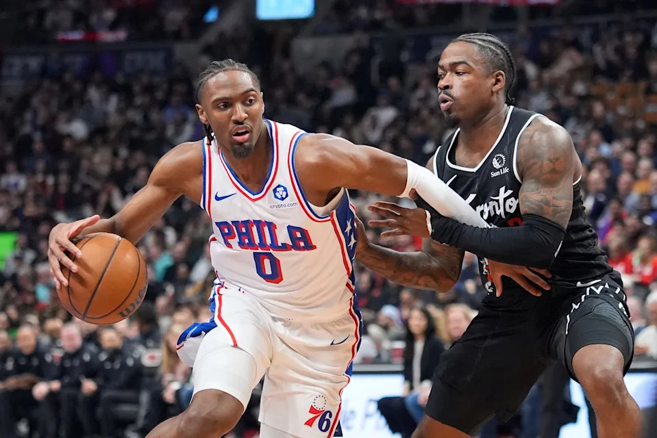 Jan 12, 2026; Toronto, Ontario, CAN; Philadelphia 76ers guard Tyrese Maxey (0) drives to the net against Toronto Raptors guard Jamal Shead (23) during the first half at Scotiabank Arena. Mandatory Credit: John E. Sokolowski-Imagn Images