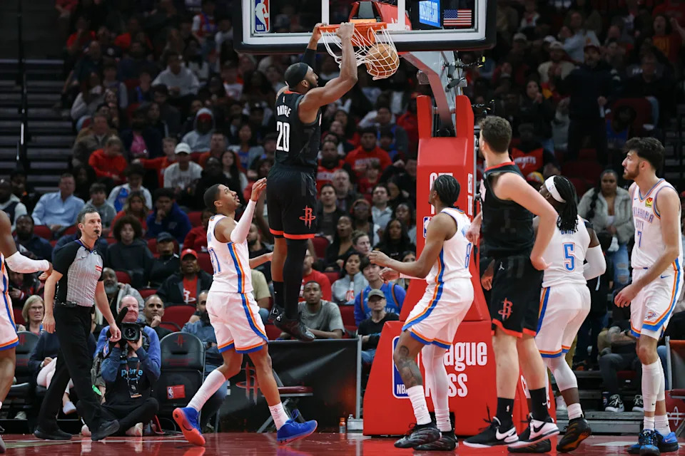 Jan 15, 2026; Houston, Texas, USA; Houston Rockets guard Josh Okogie (20) dunks the ball during the third quarter against the Oklahoma City Thunder at Toyota Center. Mandatory Credit: Troy Taormina-Imagn Images