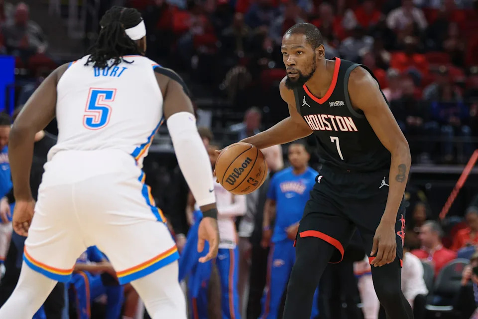 Jan 15, 2026; Houston, Texas, USA; Houston Rockets forward Kevin Durant (7) dribbles the ball as Oklahoma City Thunder guard Luguentz Dort (5) defends during the first quarter at Toyota Center. Mandatory Credit: Troy Taormina-Imagn Images