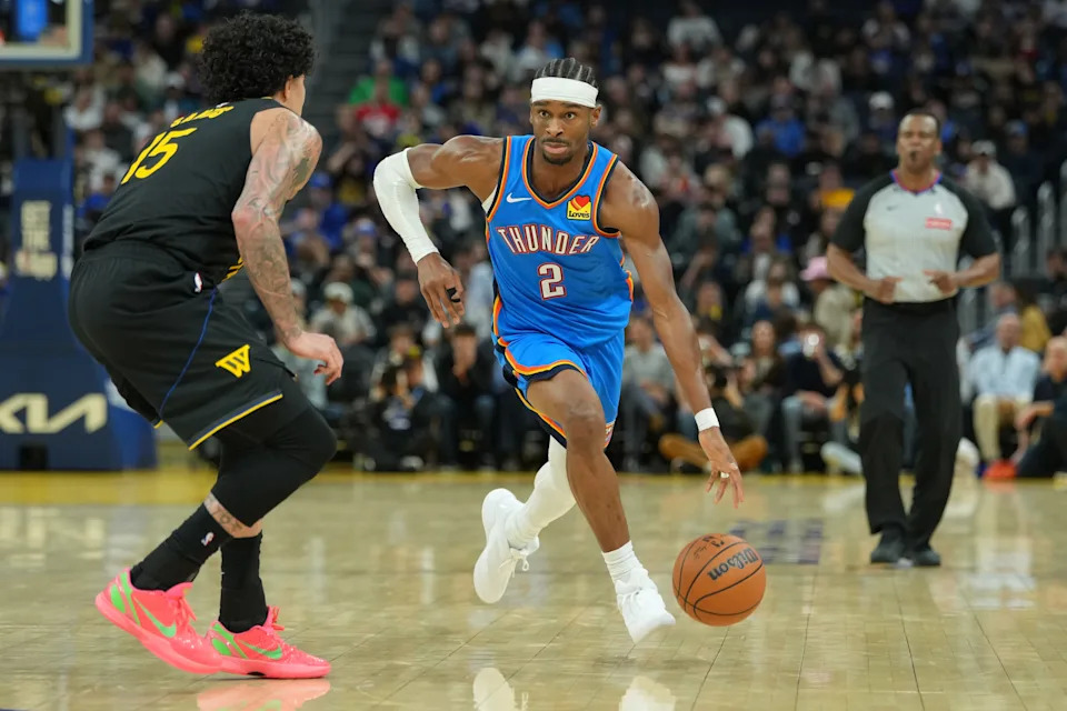 Jan 2, 2026; San Francisco, California, USA; Oklahoma City Thunder guard Shai Gilgeous-Alexander (2) dribbles against Golden State Warriors forward Gui Santos (15) during the third quarter at Chase Center. Mandatory Credit: Darren Yamashita-Imagn Images
