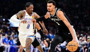 San Antonio Spurs Victor Wembanyama (1) drives against Oklahoma City Thunder guard/forward Jalen Williams (8) during the first half of an NBA basketball game, Thursday, Dec. 25, 2025, in Oklahoma City. (AP Photo/Gerald Leong)