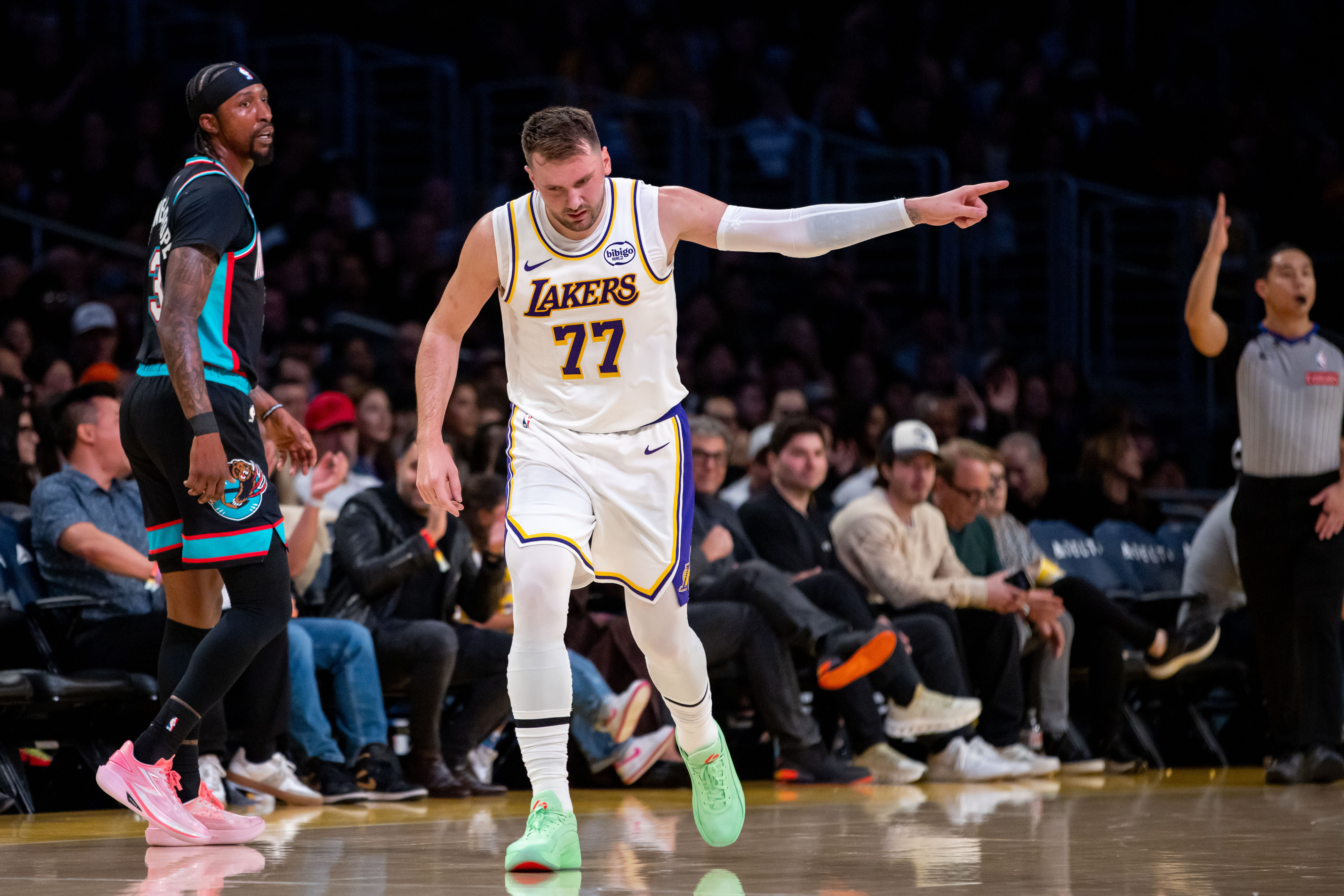 Lakers guard Luka Doncic (77) gestures during the first half...