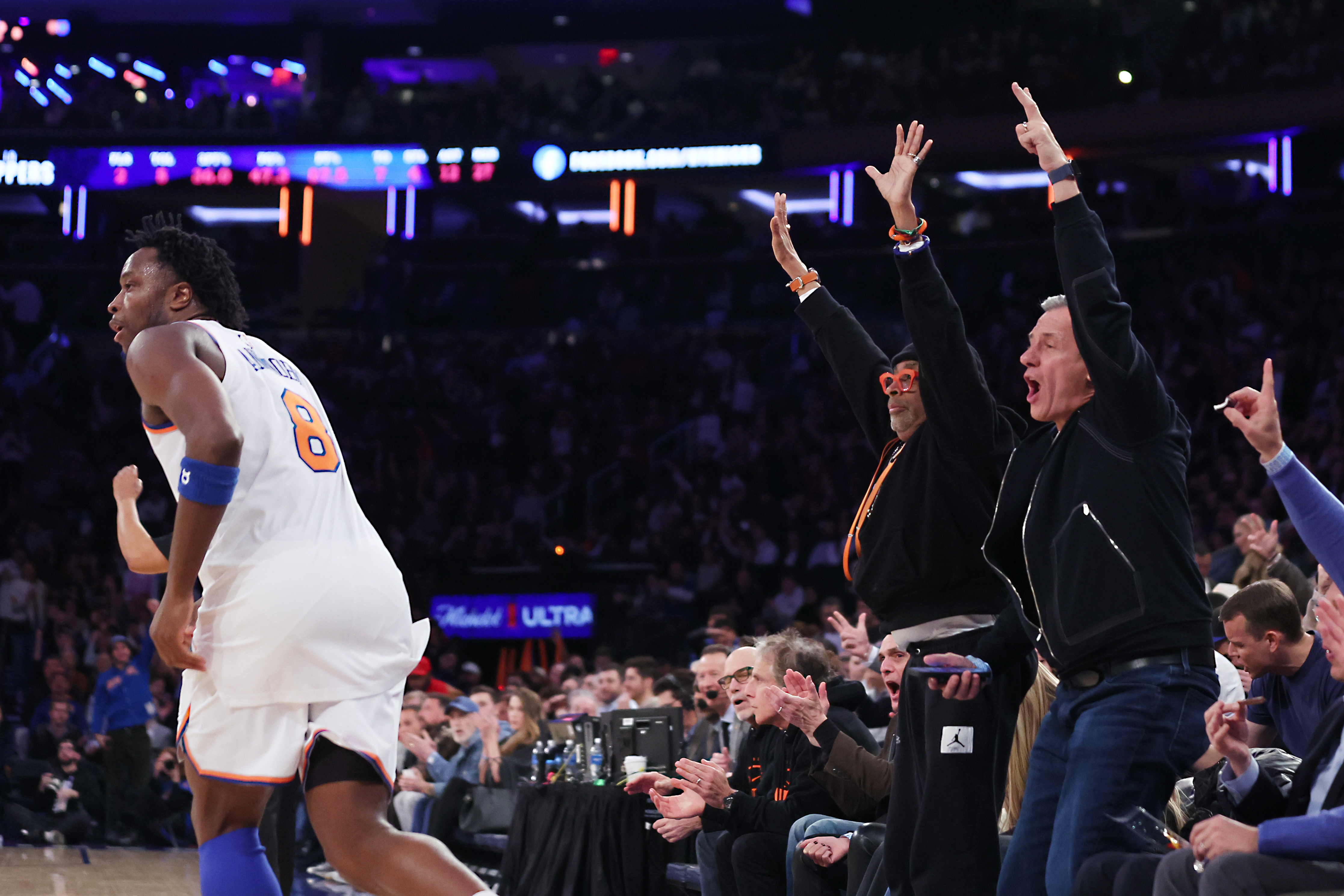 Members of celebrity row including Spike Lee, center left, celebrate...