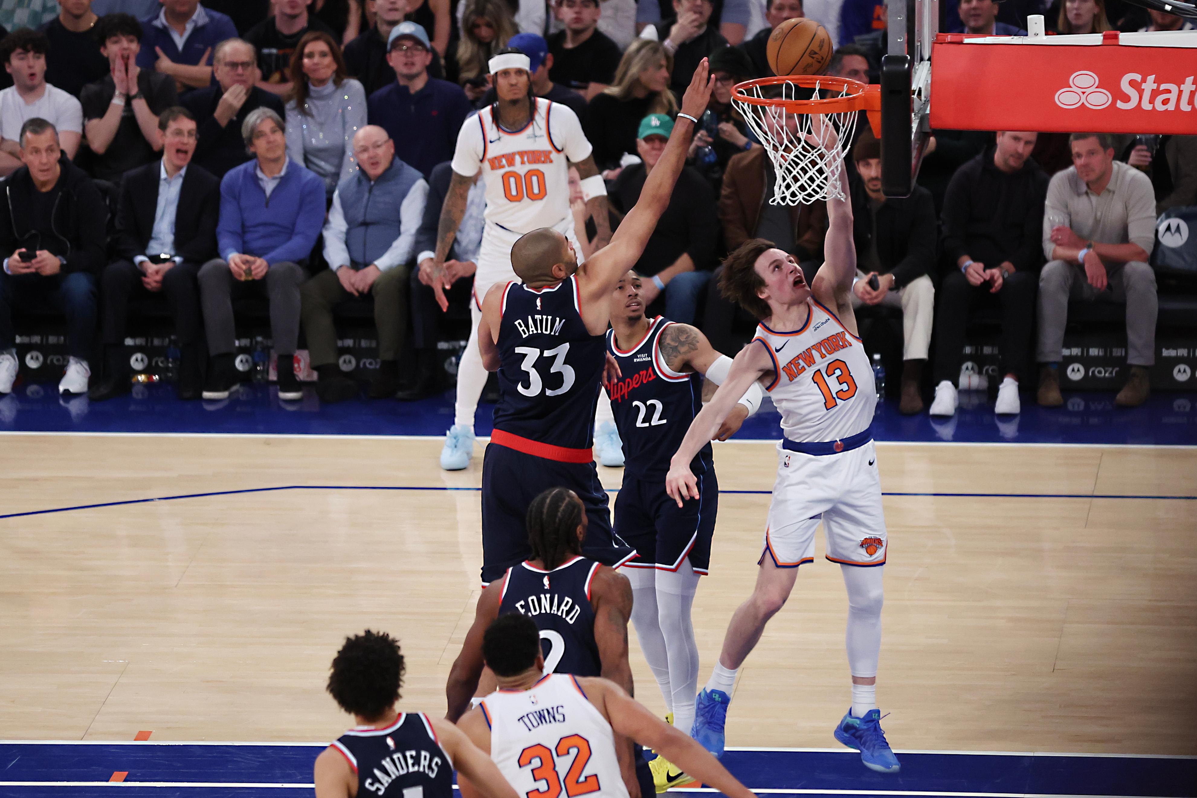 New York Knicks guard Tyler Kolek (13) drives to the...