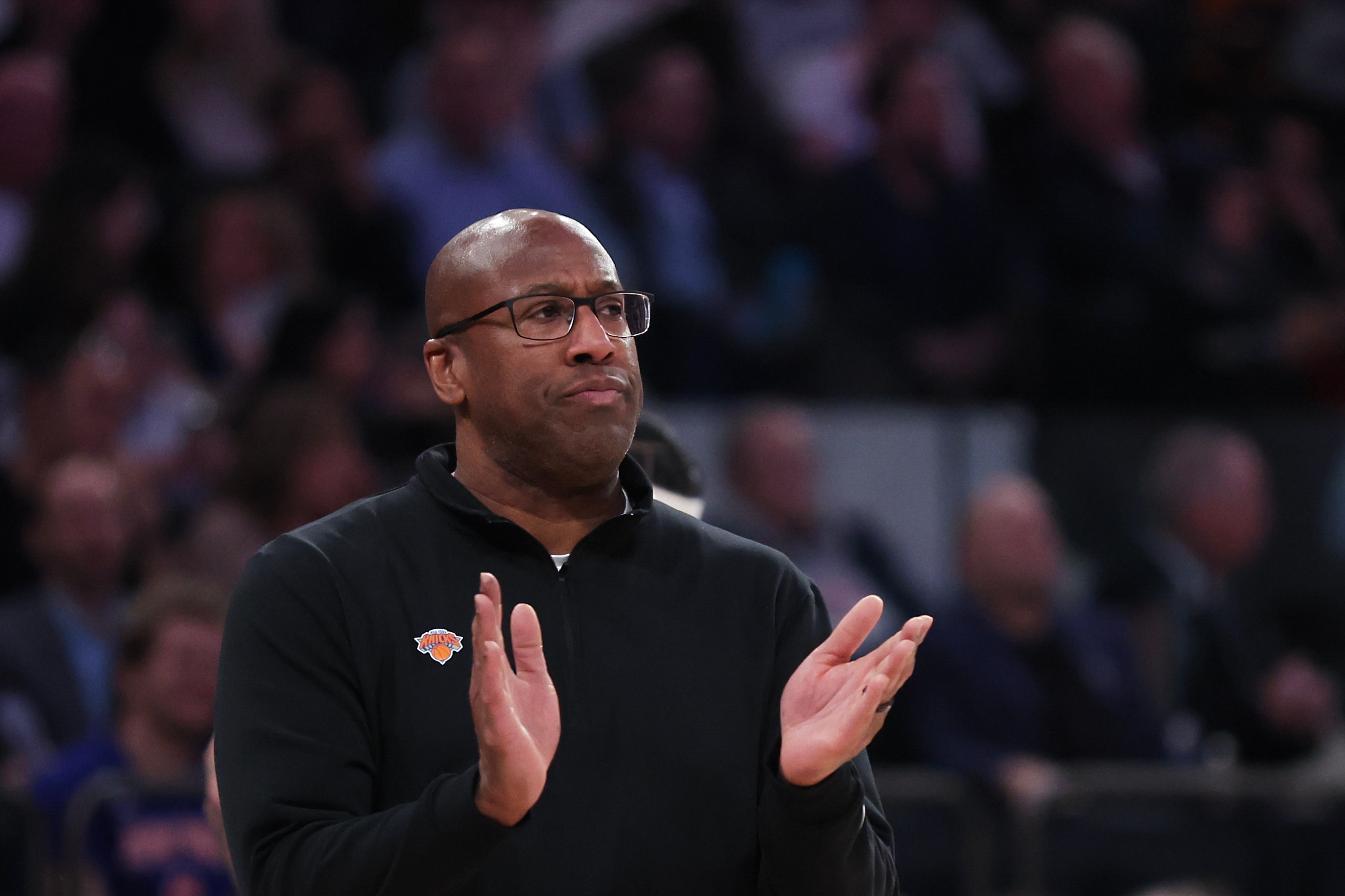 New York Knicks head coach Mike Brown claps on the...