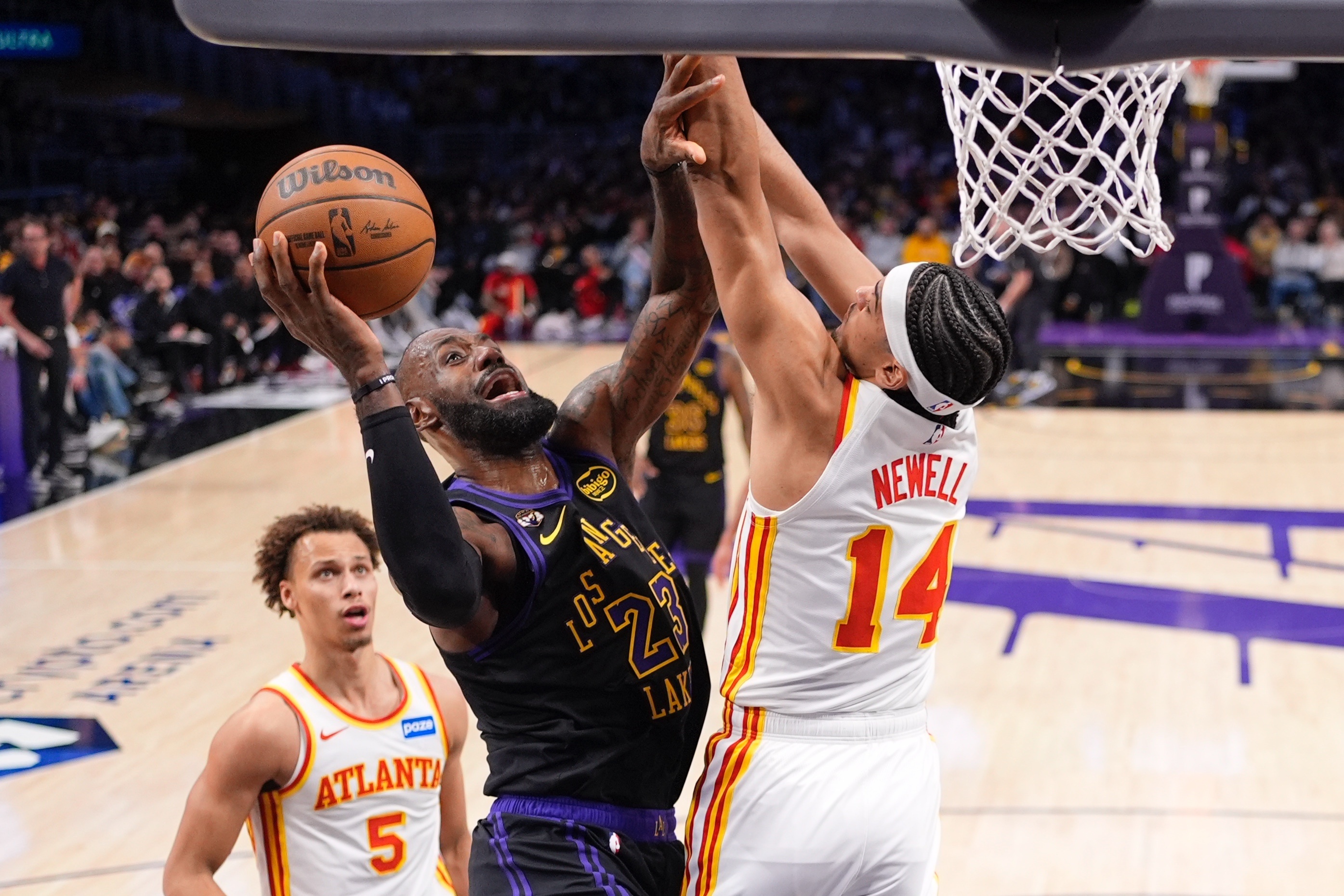 Lakers forward LeBron James shoots as Atlanta Hawks forward Asa...