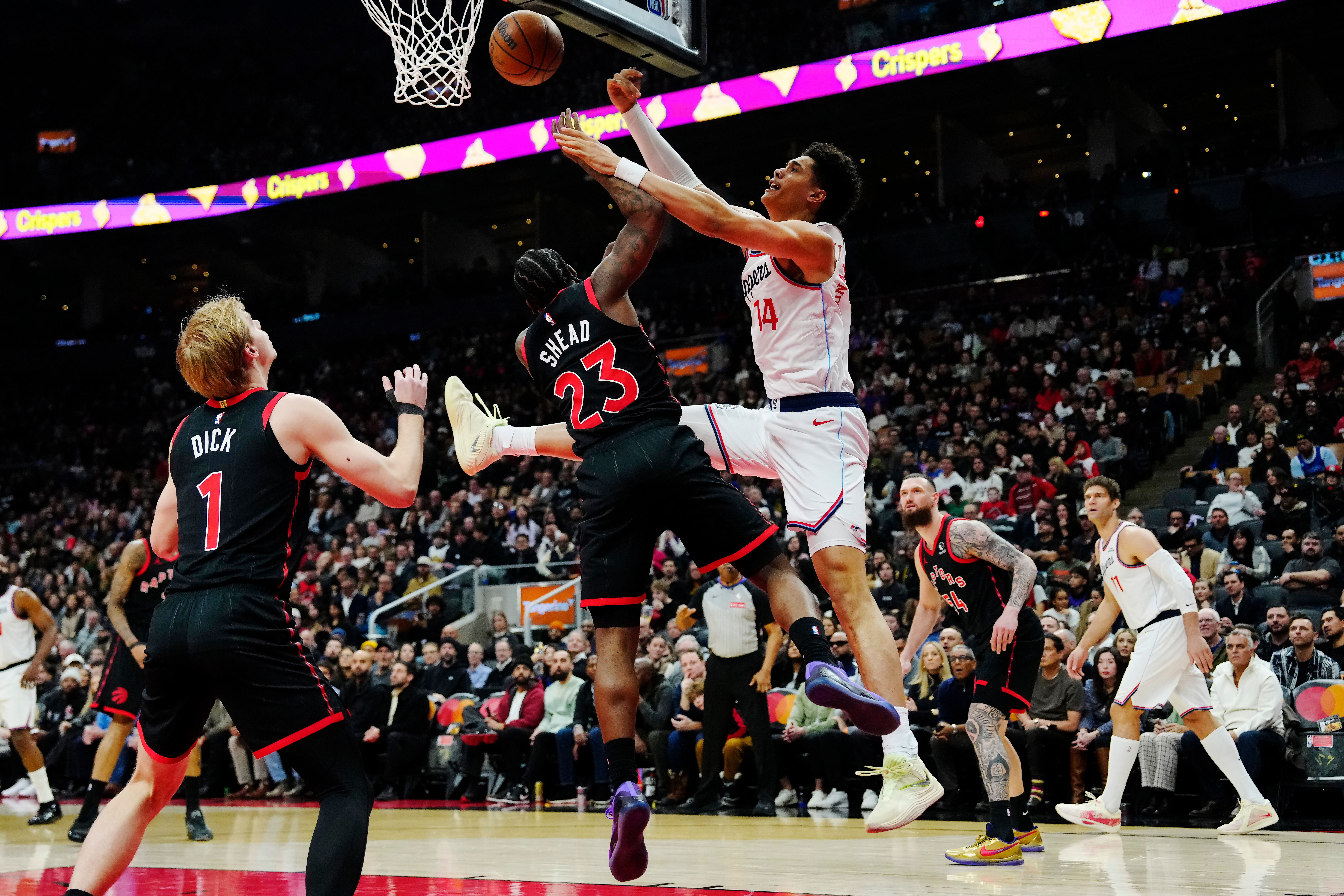 The Toronto Raptors’ Jamal Shead (23) and Clippers rookie center...