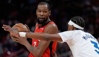 Minnesota Timberwolves forward Jaden McDaniels (3) defends against Houston Rockets forward Kevin Durant (7) during the first half of an NBA basketball game in Houston, Friday, Jan. 16, 2026. (AP Photo/Ashley Landis)