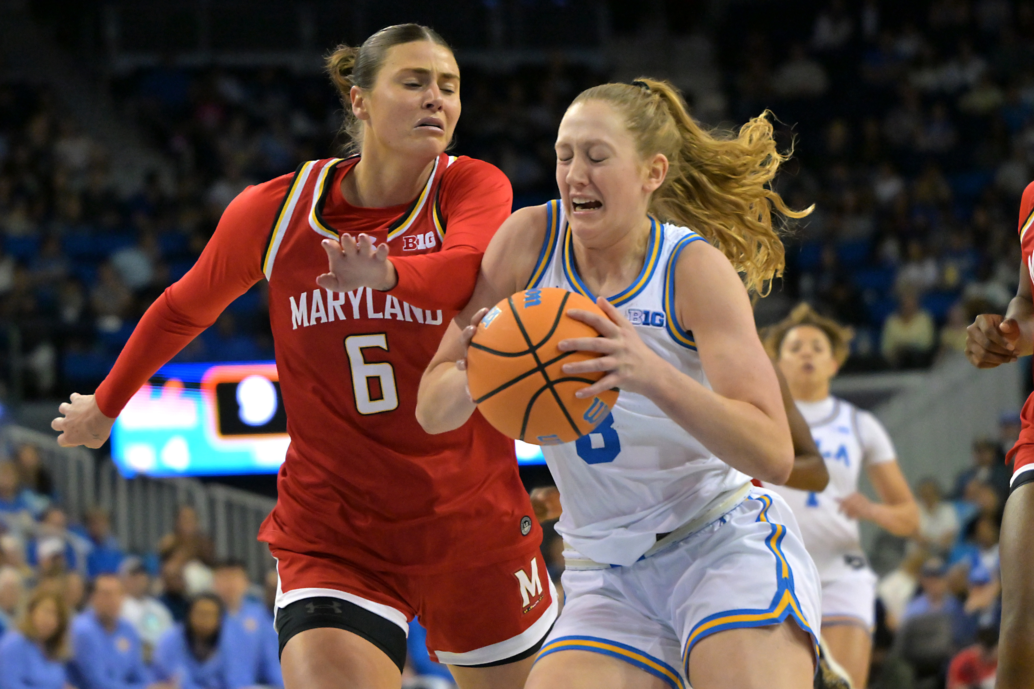 UCLA guard Gianna Kneepkens, right, is defended by Maryland guard...