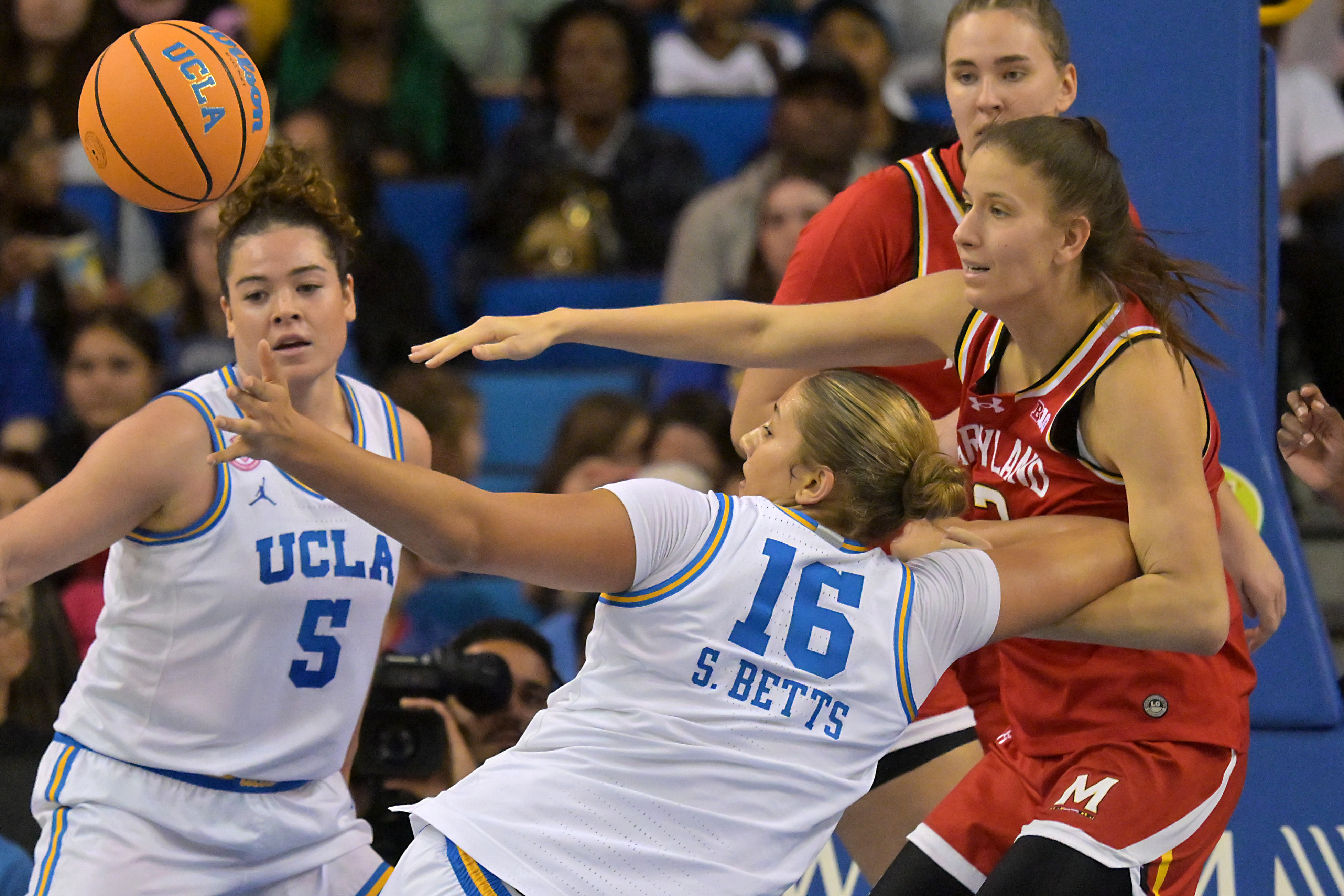 UCLA forward Sienna Betts (16) and Maryland guard Yarden Garzon...