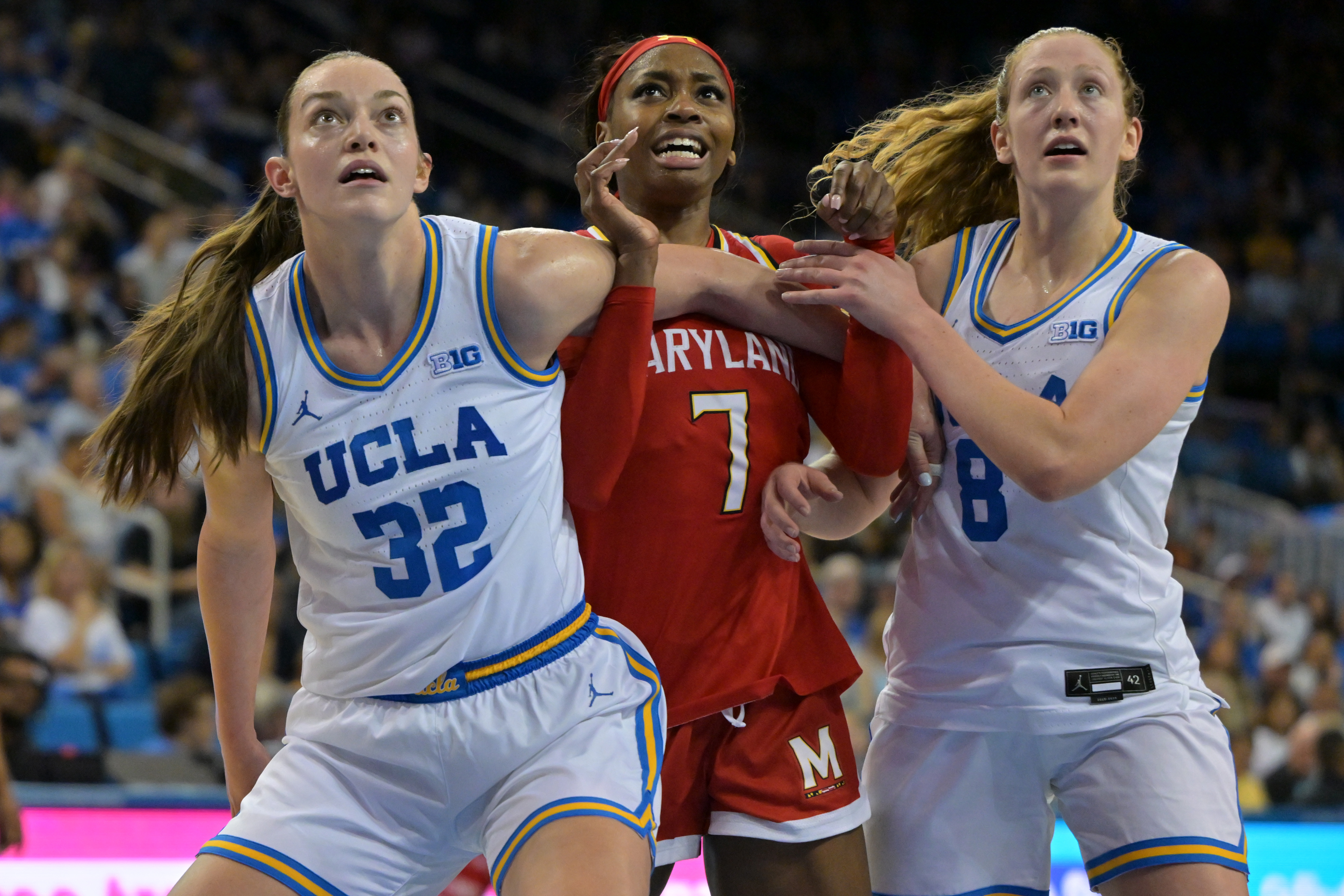 UCLA forward Angela DugaliÄ, left, and UCLA guard Gianna Kneepkens,...