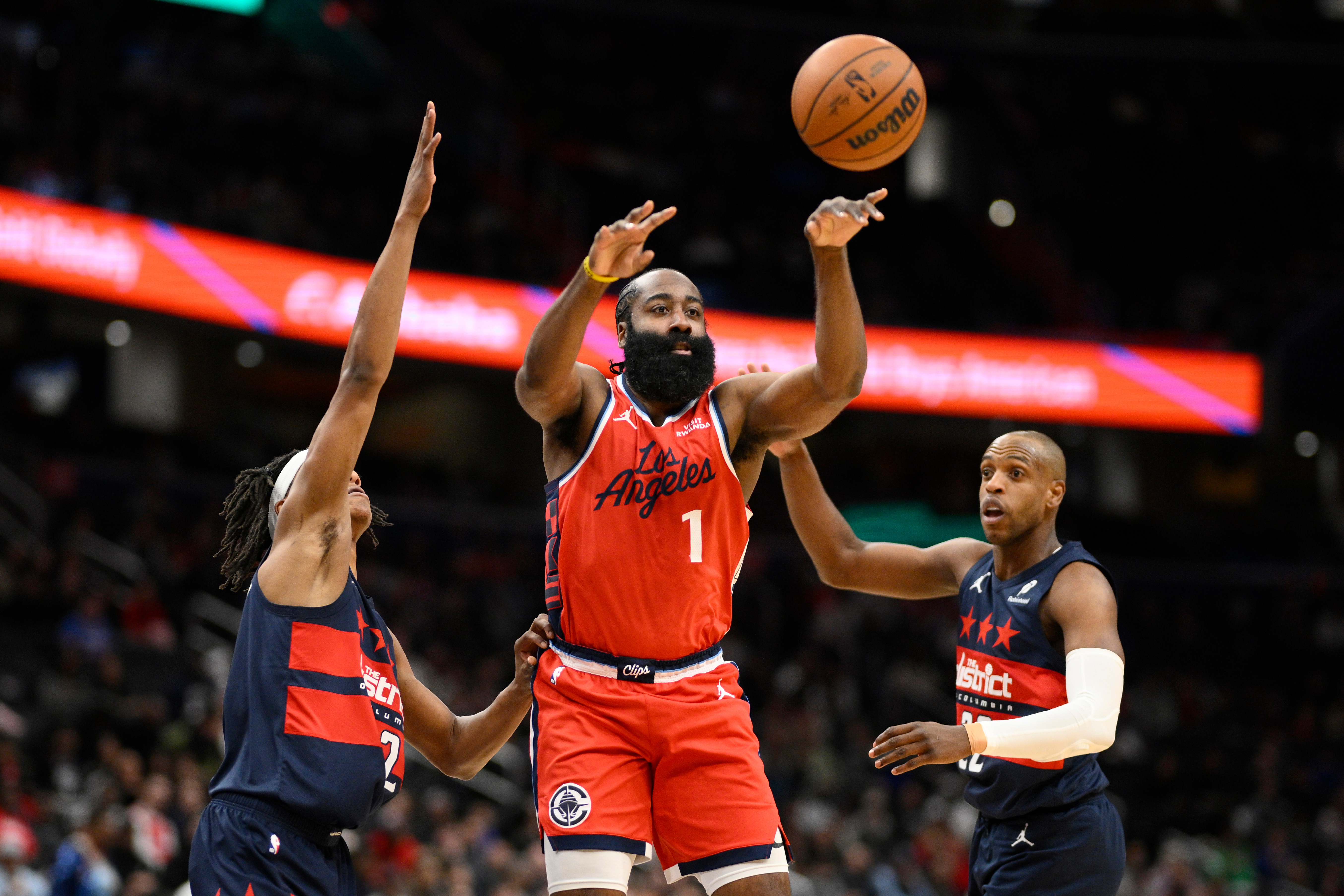 Clippers guard James Harden passes the ball as Washington Wizards...