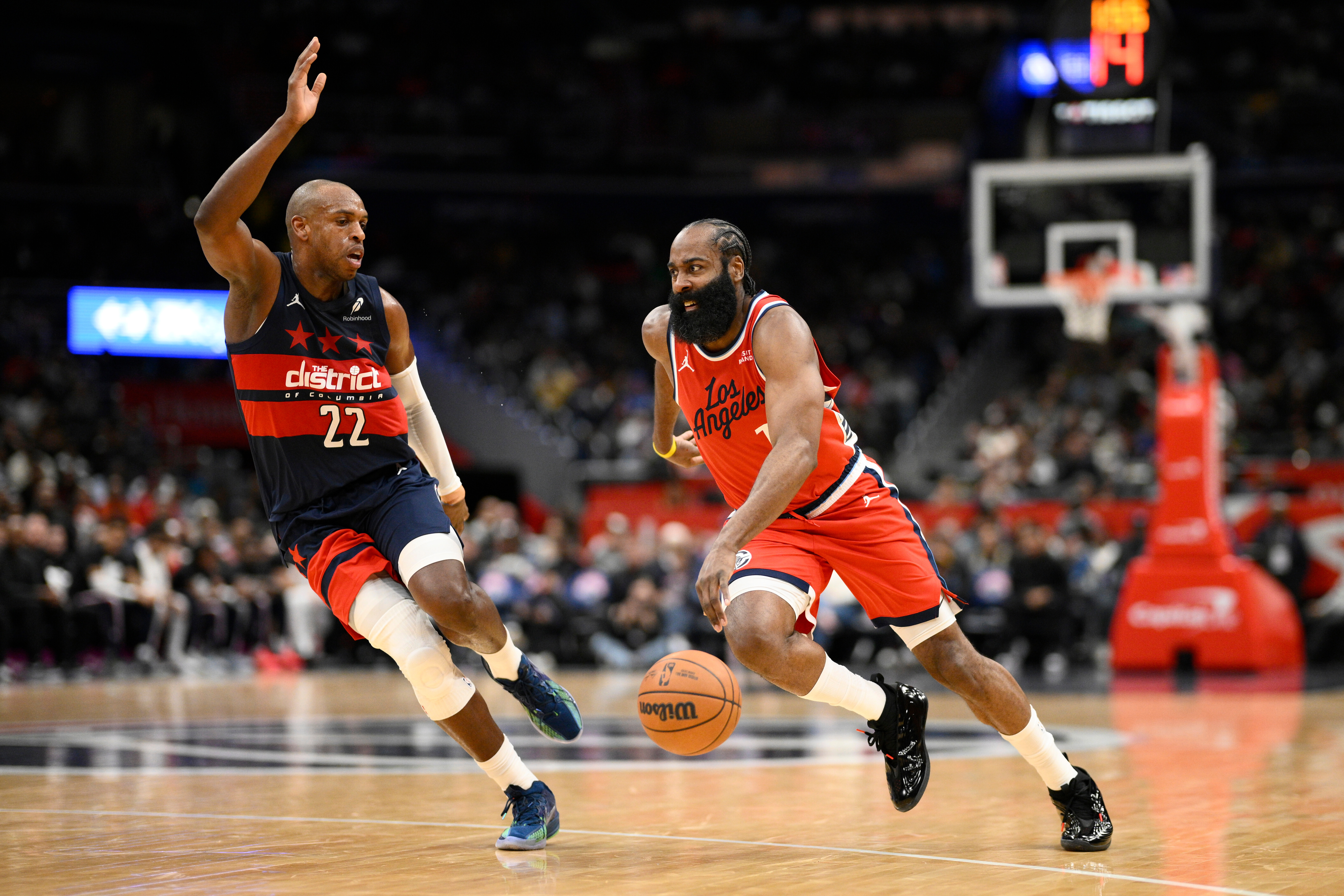 Clippers guard James Harden drives as Washington Wizards forward Khris...