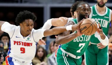Detroit Pistons guard Ausar Thompson (9) knocks the ball away from Boston Celtics guard Jaylen Brown (7) during the first half of an NBA basketball game Monday, Jan. 19, 2026, in Detroit. (AP Photo/Duane Burleson)