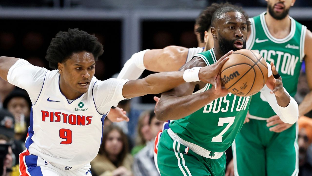 Detroit Pistons guard Ausar Thompson (9) knocks the ball away from Boston Celtics guard Jaylen Brown (7) during the first half of an NBA basketball game Monday, Jan. 19, 2026, in Detroit. (AP Photo/Duane Burleson)