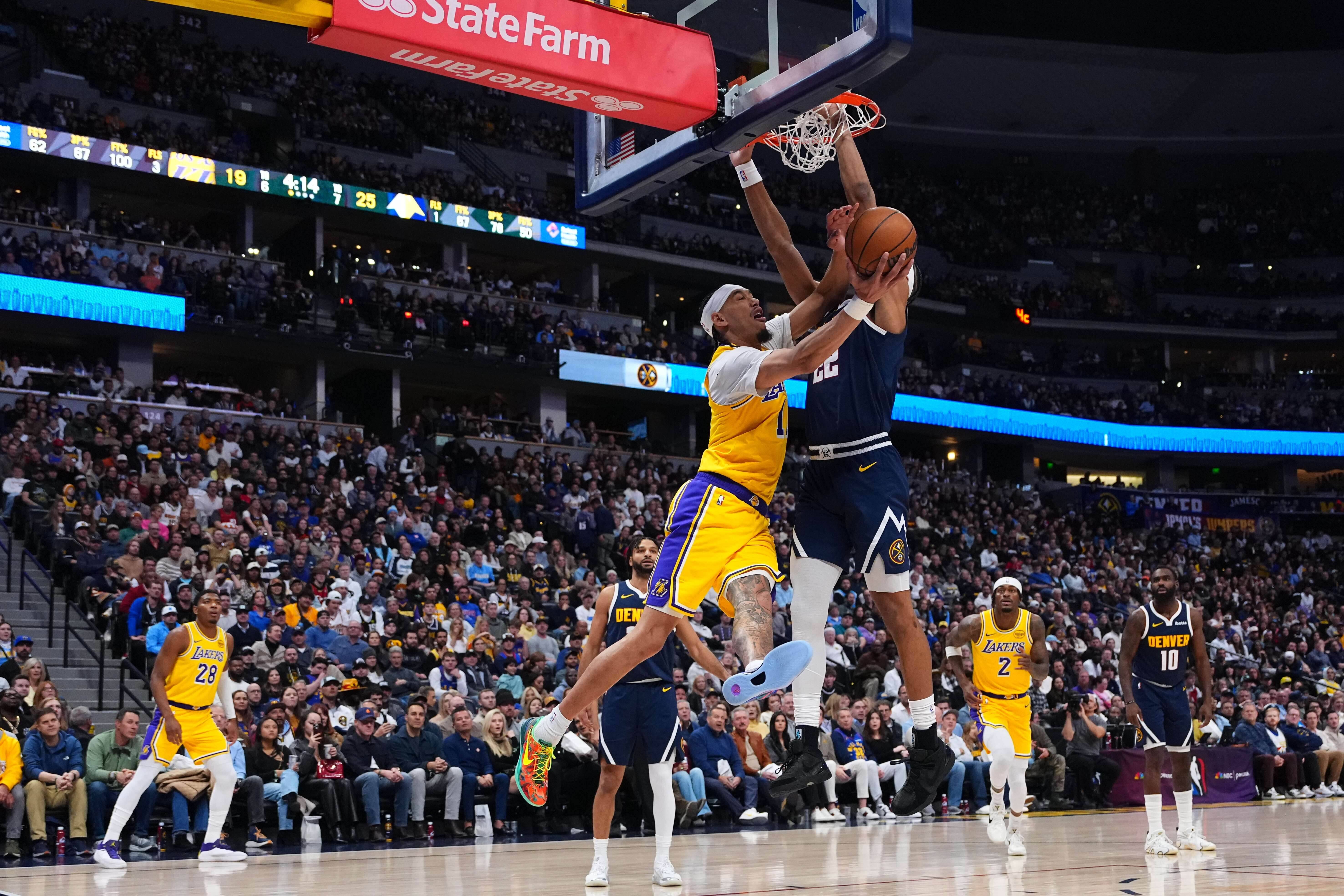 Lakers center Jaxson Hayes (11) is fouled by Denver Nuggets...