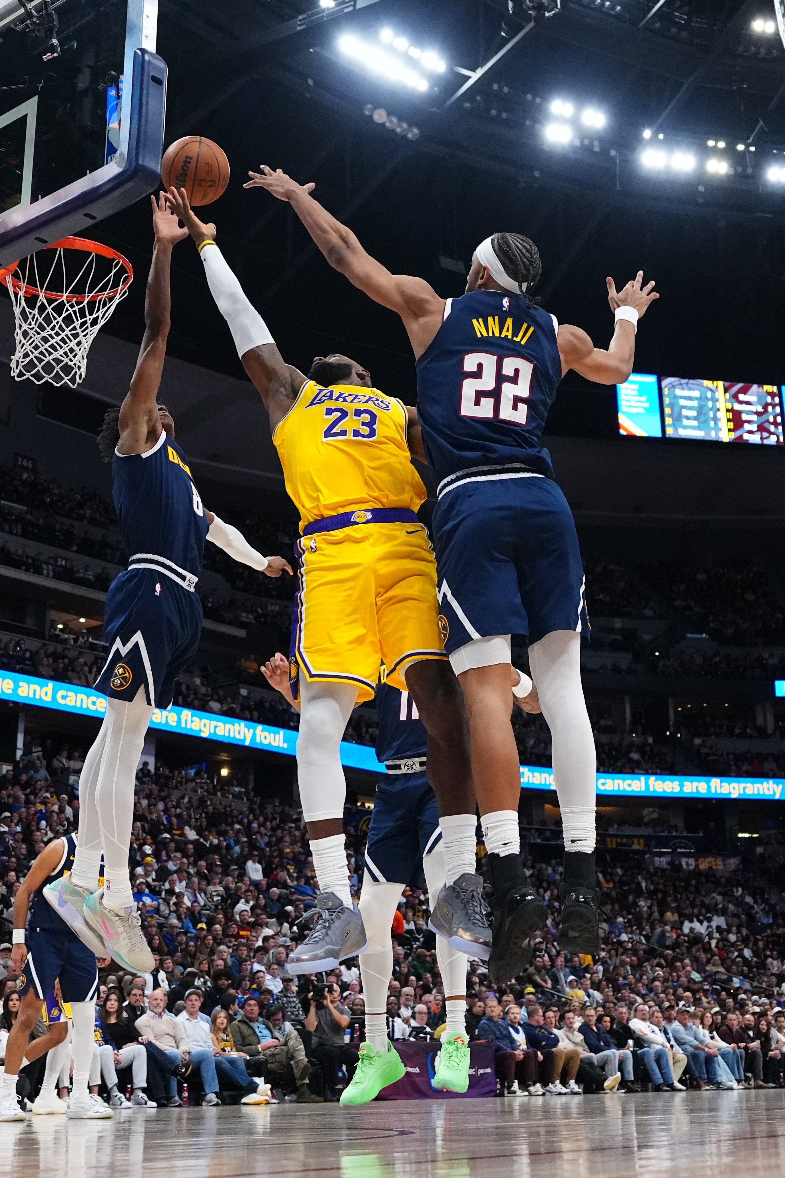 Denver Nuggets guard Peyton Watson (8) blocks a shot by...