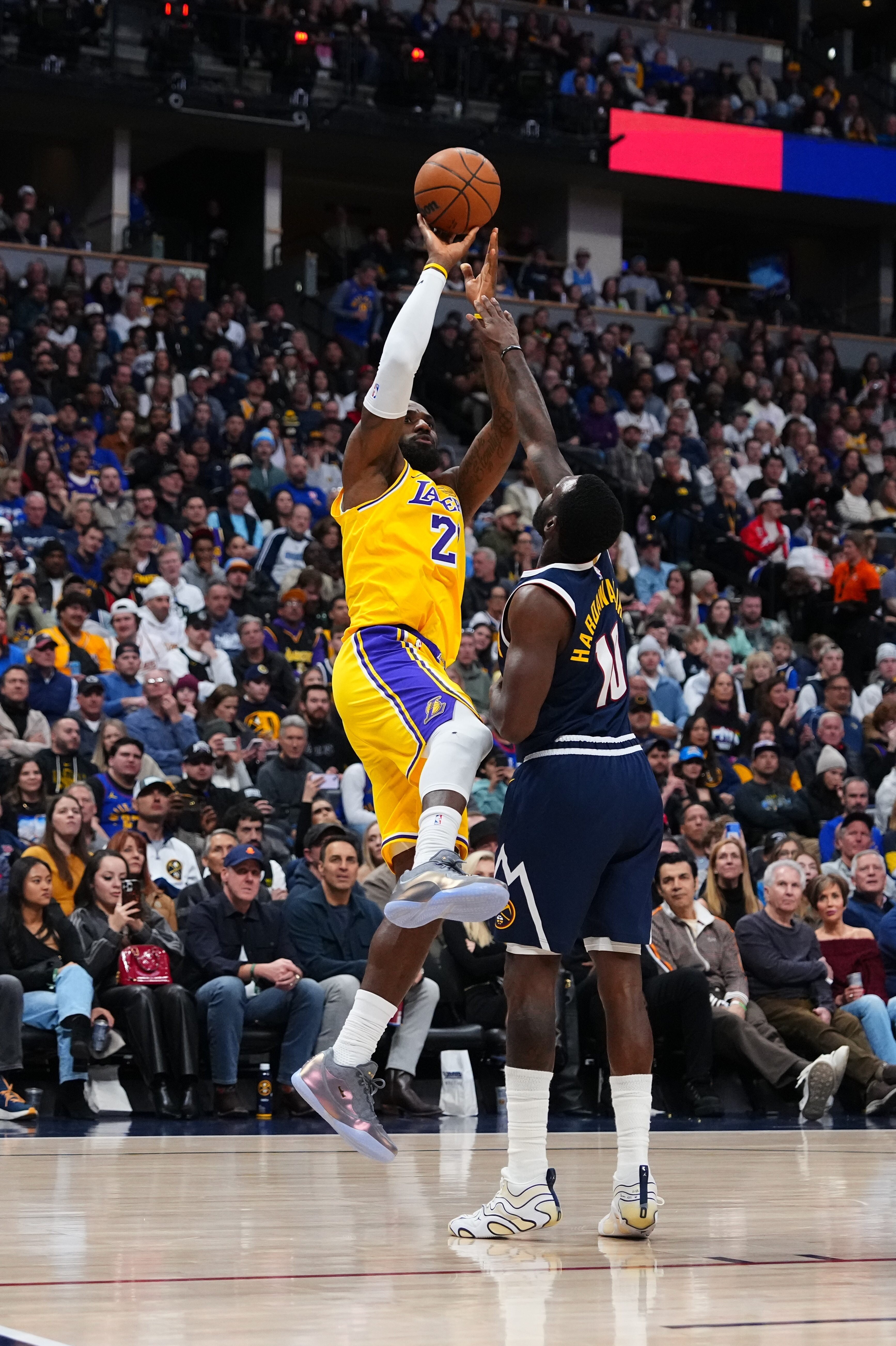 Lakers forward LeBron James (23) shoots against Denver Nuggets forward...