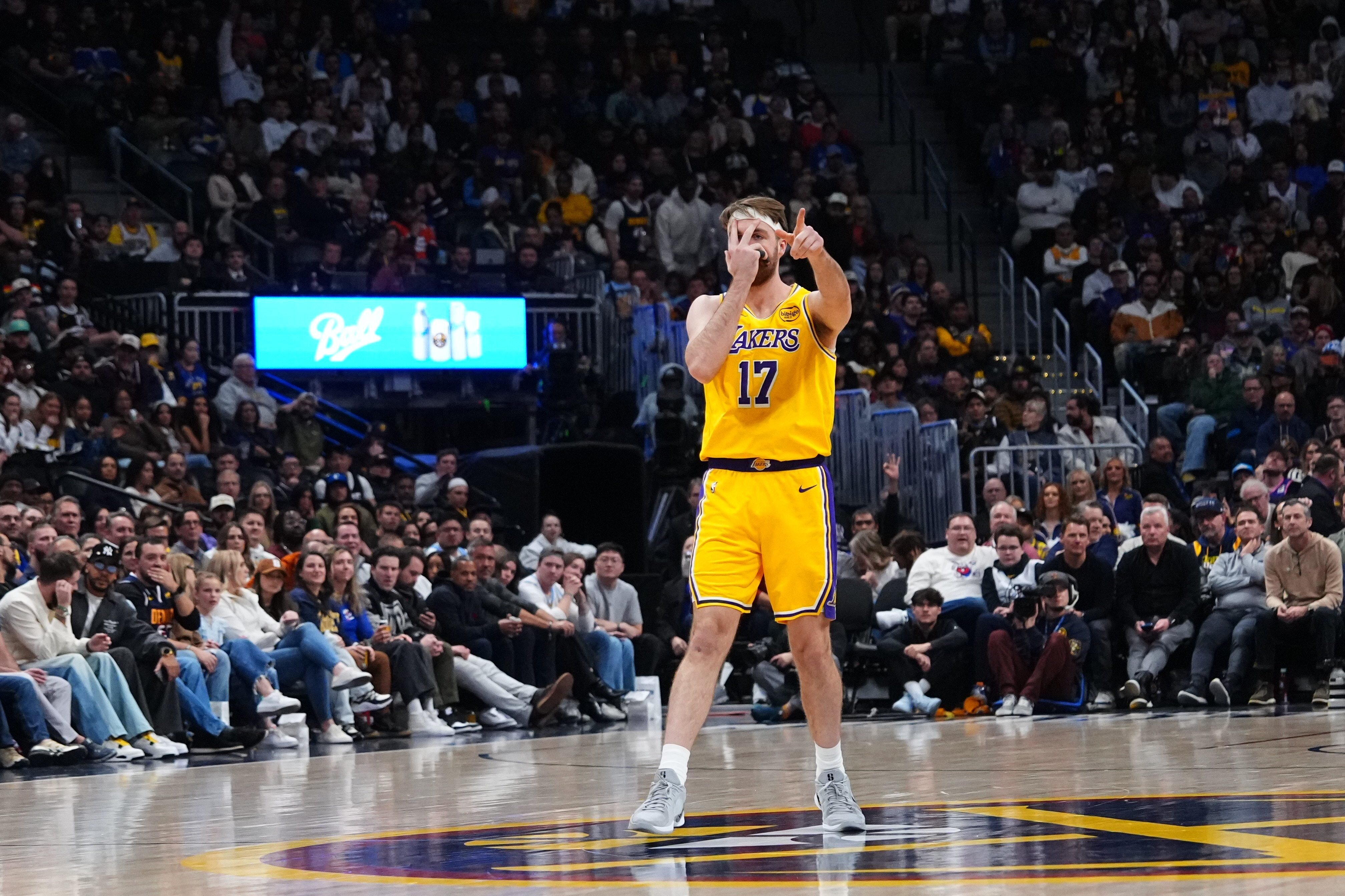 Lakers forward Drew Timme celebrates a 3-point basket against the...
