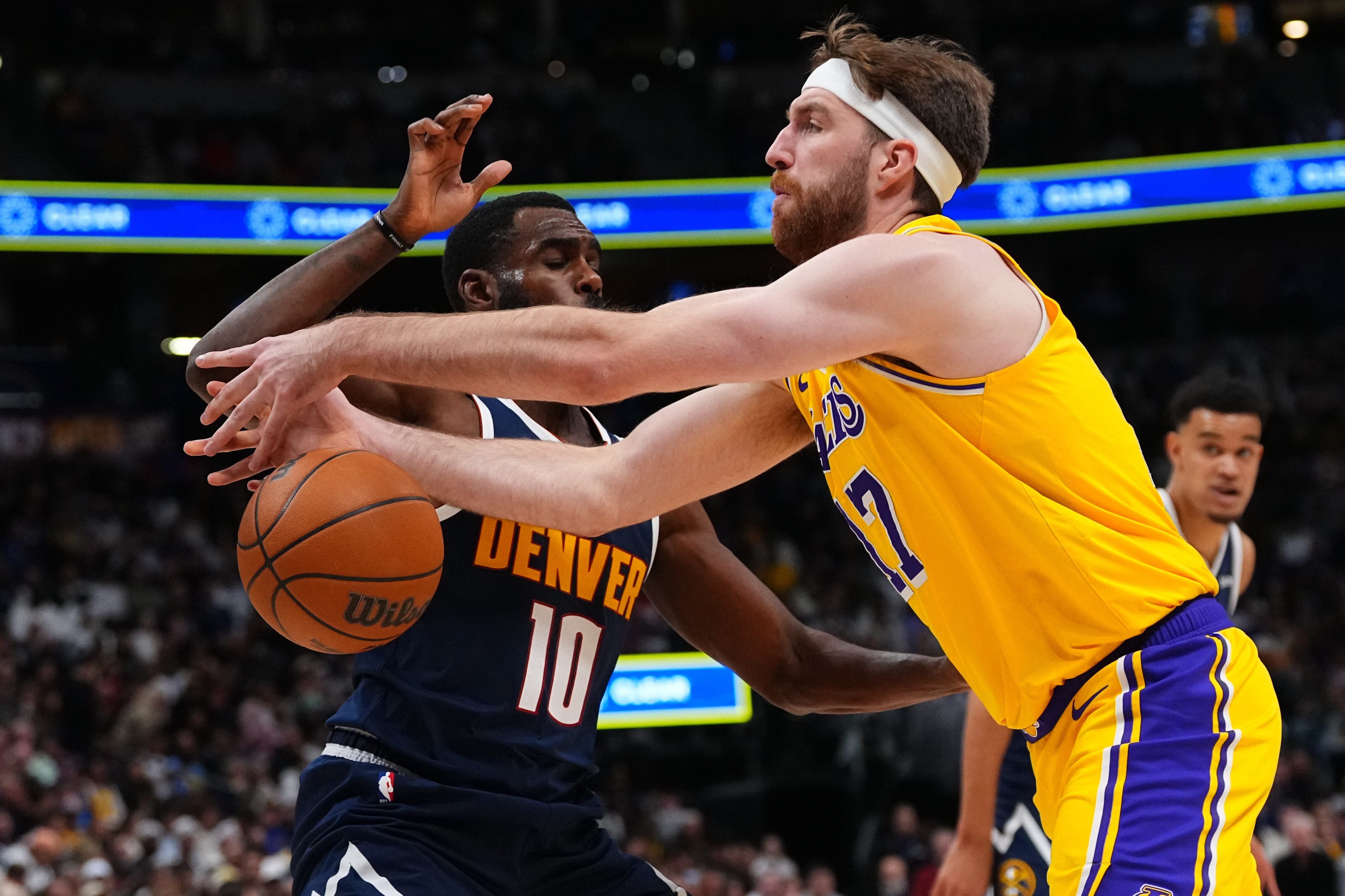Lakers forward Drew Timme loses the ball against Denver Nuggets...