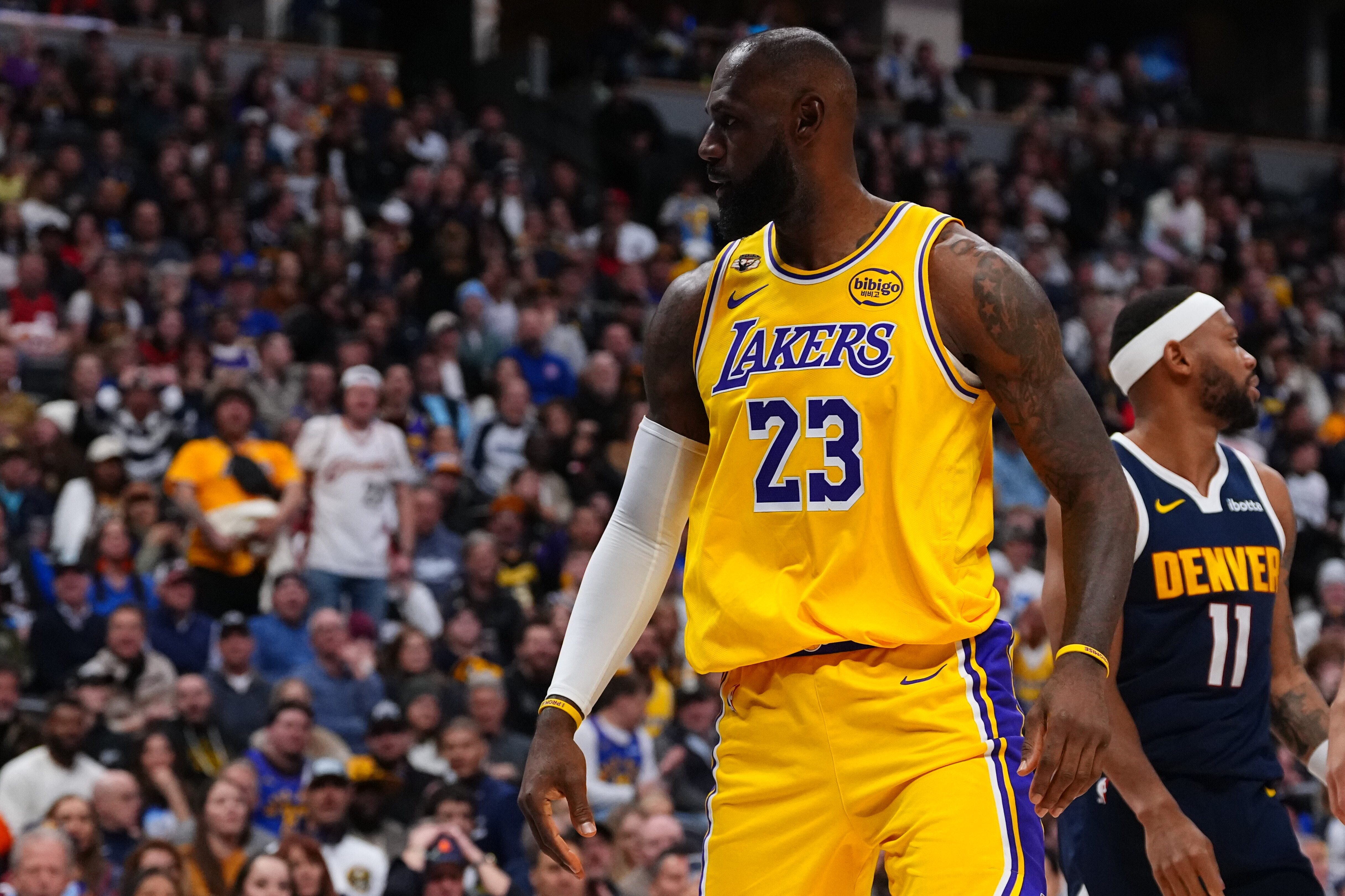 Lakers forward LeBron James reacts after a dunk against the...