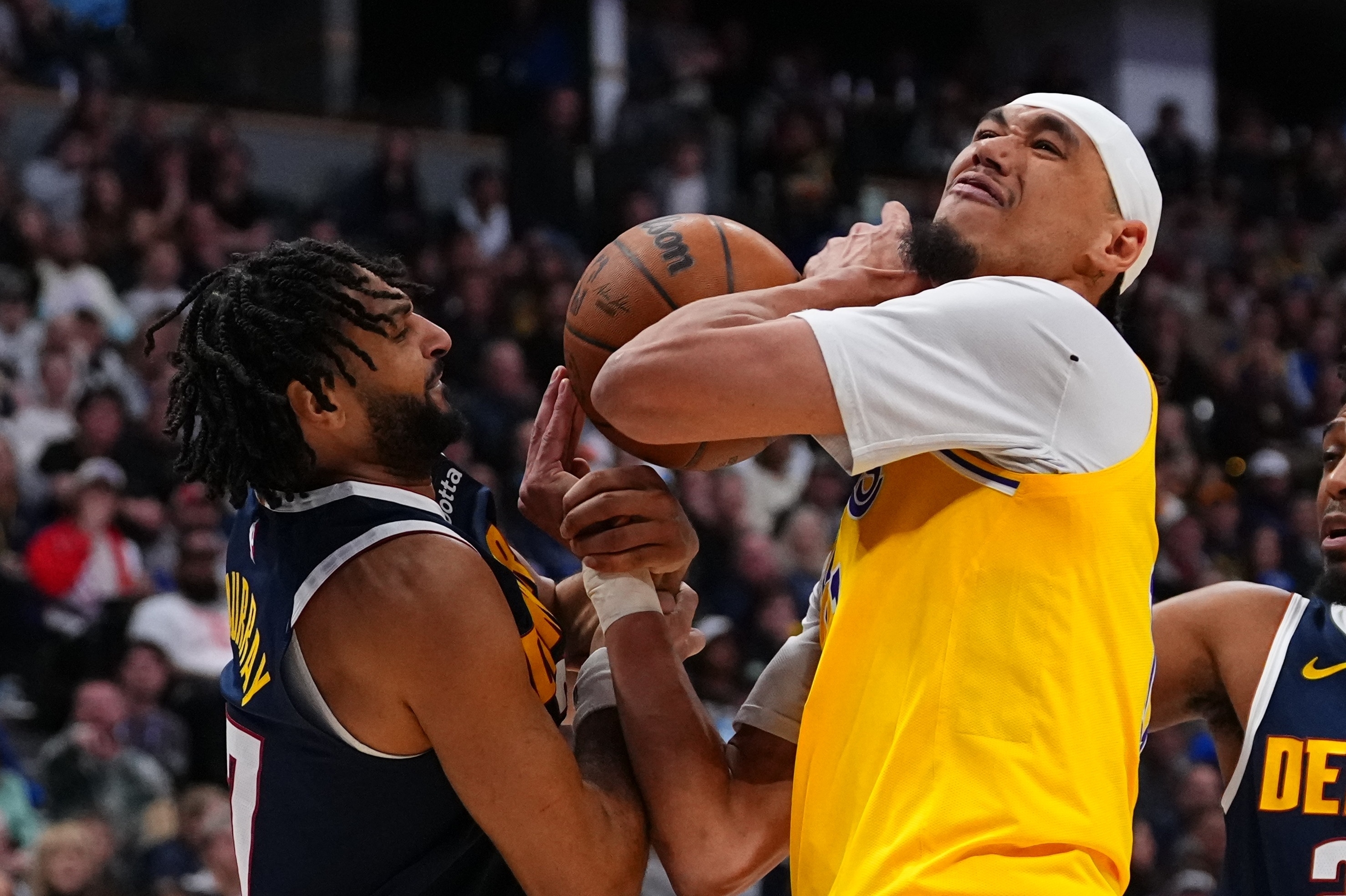 Lakers center Jaxson Hayes (11) is fouled by Denver Nuggets...