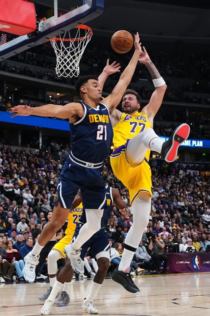 Denver Nuggets forward Spencer Jones and Los Angeles Lakers guard Luka Doncic