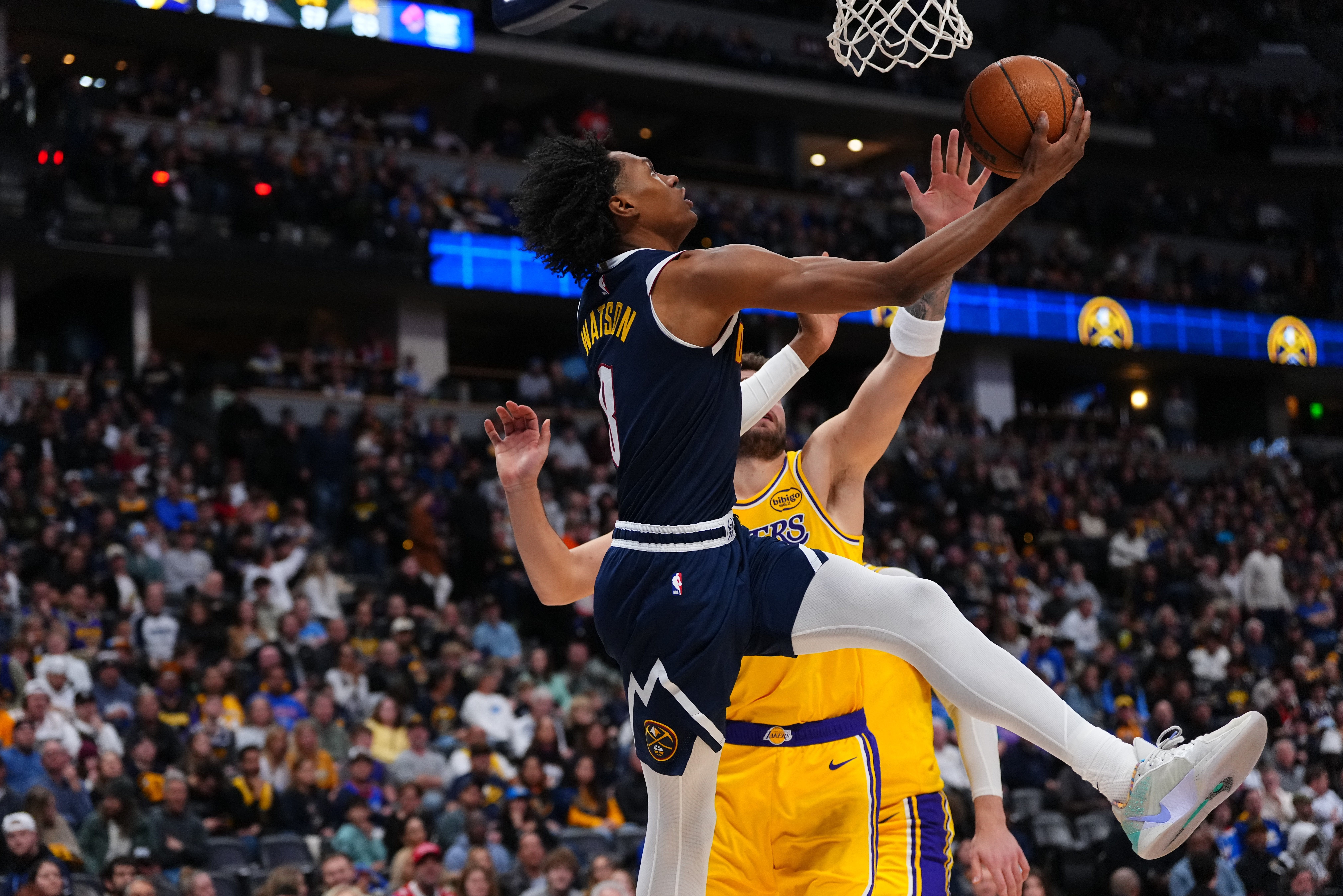 Denver Nuggets guard Peyton Watson (8) goes up for a...