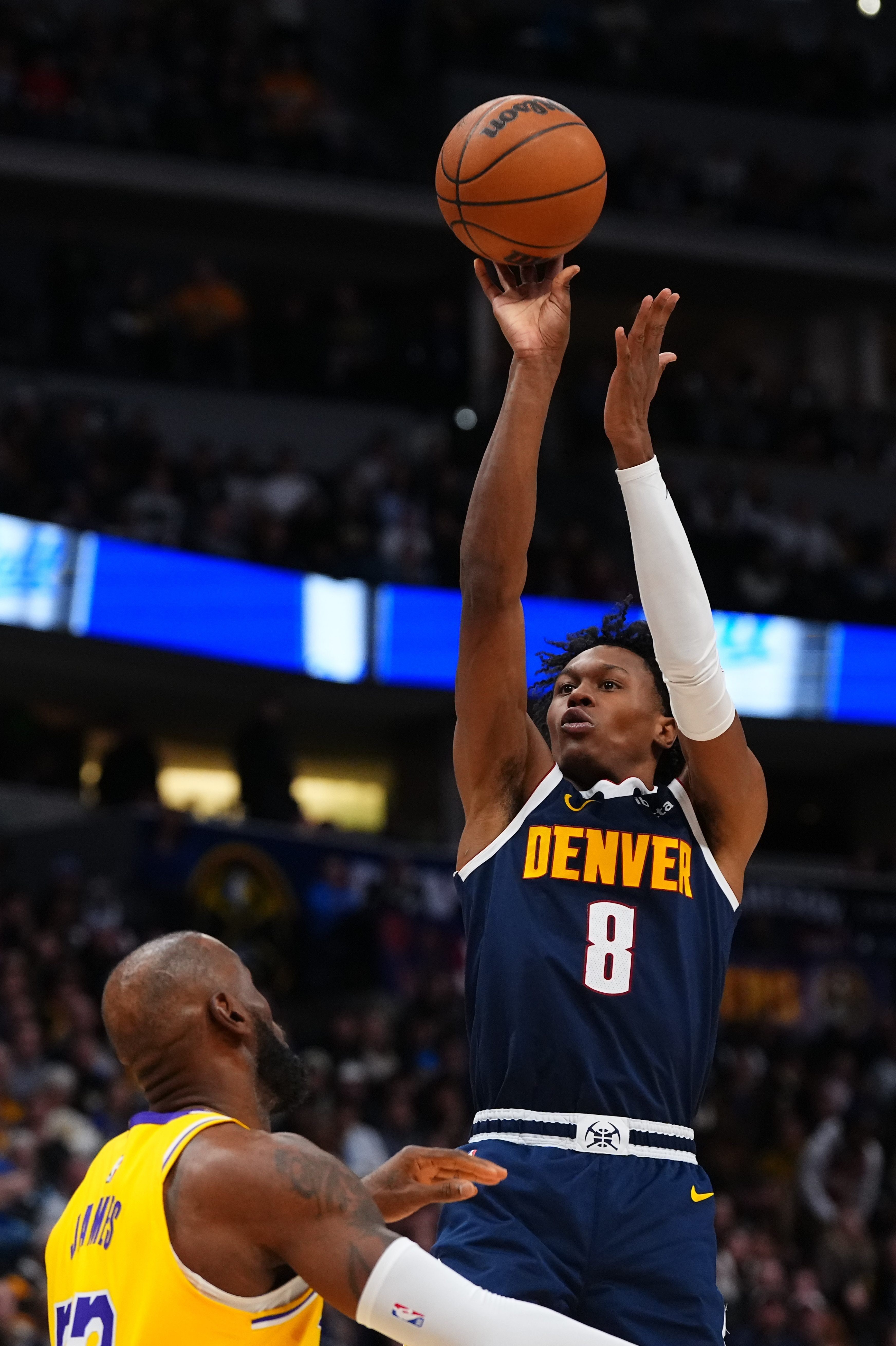 Denver Nuggets guard Peyton Watson (8) shoots over Lakers forward...