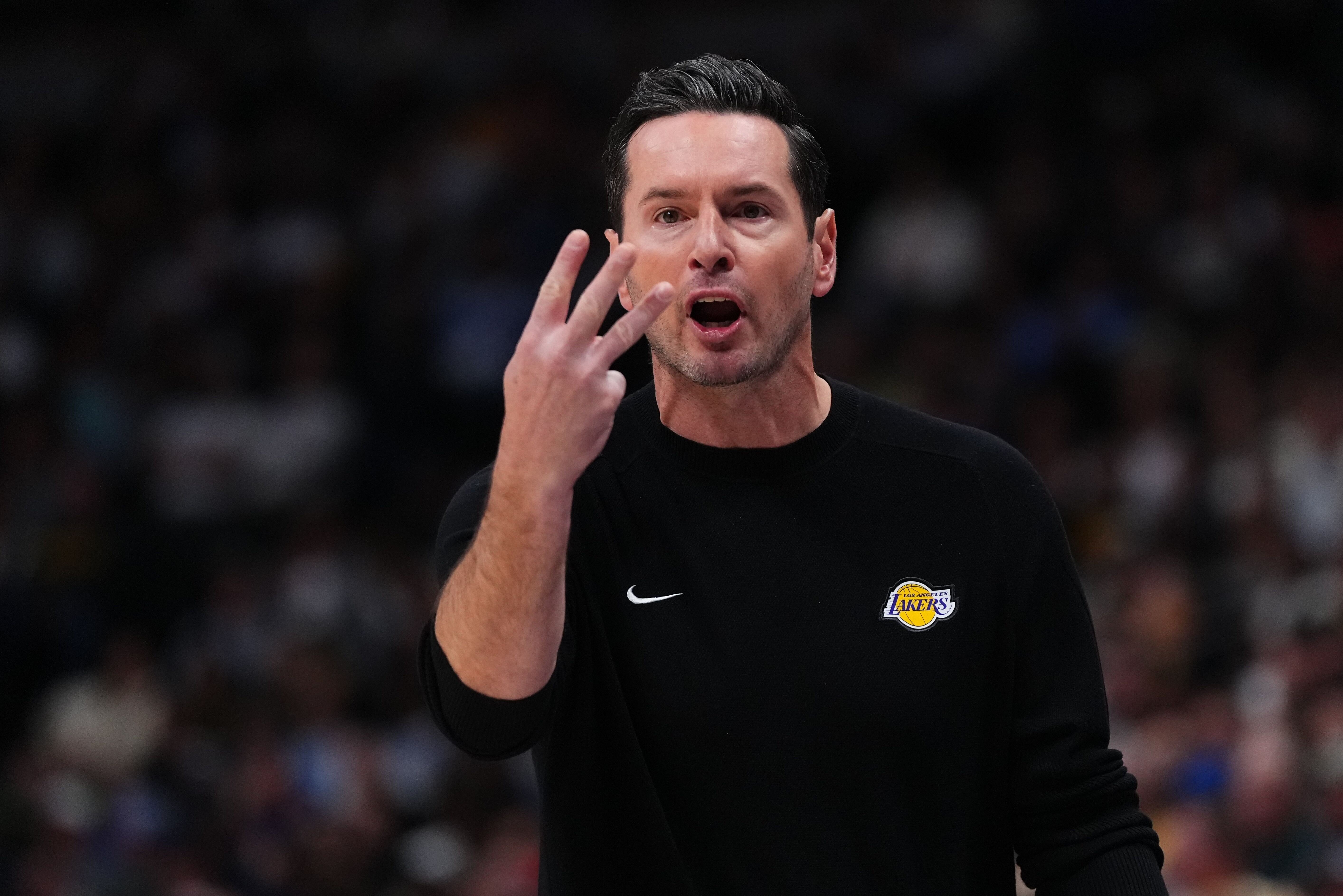 Lakers head coach JJ Redick reacts against the Denver Nuggets...