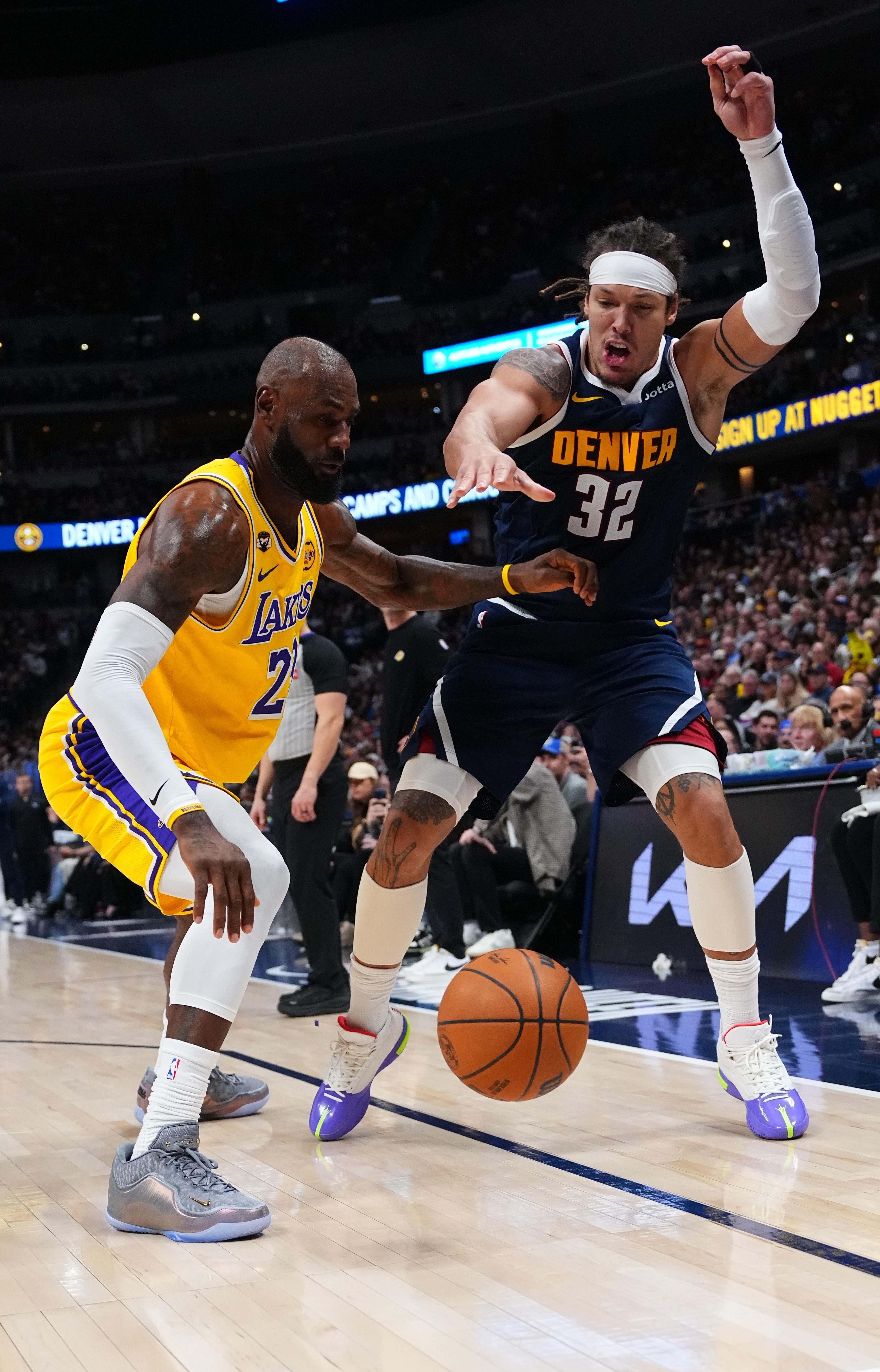 Denver Nuggets forward Aaron Gordon (32) loses the ball against...