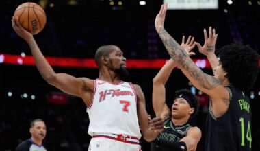 Houston Rockets forward Kevin Durant (7) looks to pass over New Orleans Pelicans guard Jeremiah Fears (0) and guard Micah Peavy (14) during the second half of an NBA basketball game in Houston, Sunday, Jan. 18, 2026. (AP Photo/Ashley Landis)