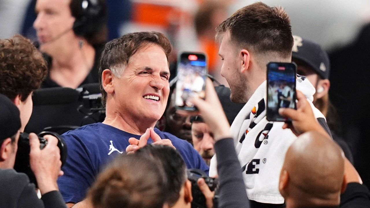 Mark Cuban, center left, greets former Dallas Mavericks player Luka Doncic of the Los Angeles Lakers following an NBA basketball game in Dallas, April 9, 2025. (AP Photo/LM Otero)