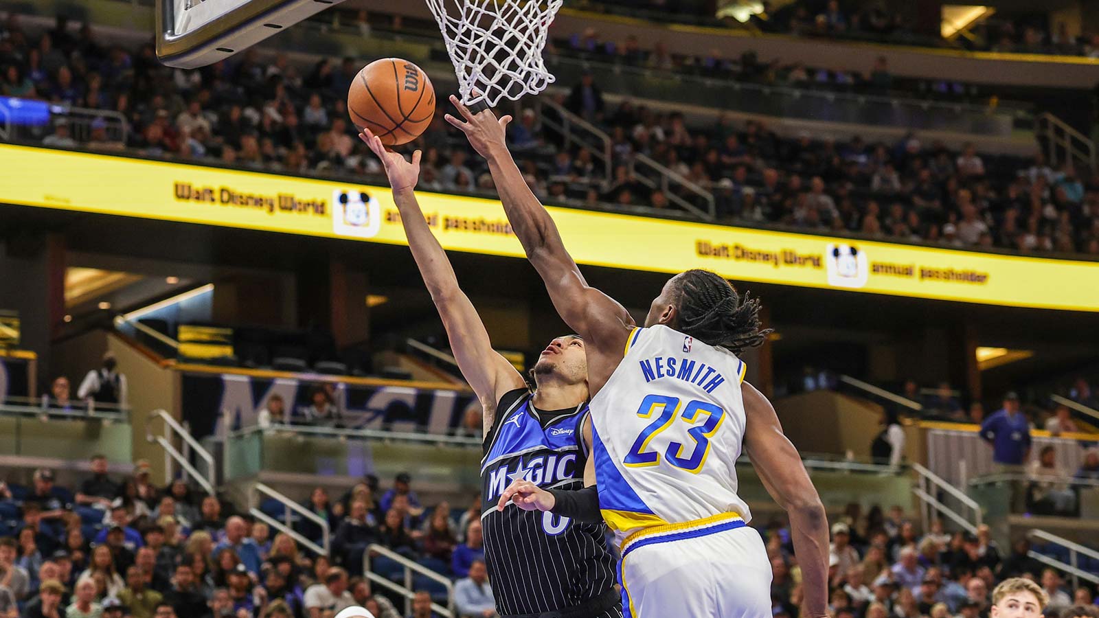 Orlando Magic guard Anthony Black (0) goes to the basket against Indiana Pacers guard Aaron Nesmith (23) during the first quarter at Kia Center.